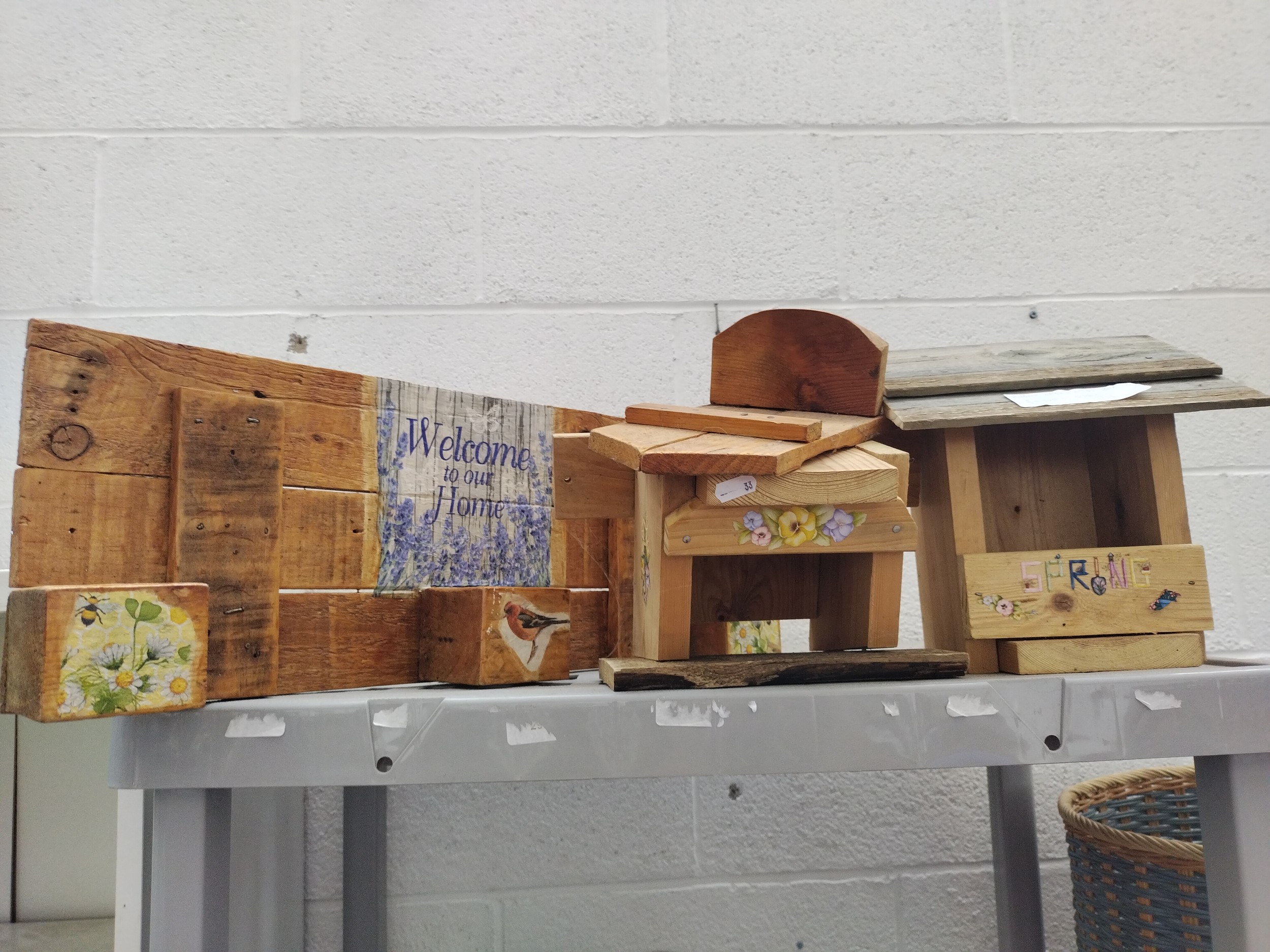 Bird houses and wooden plaque