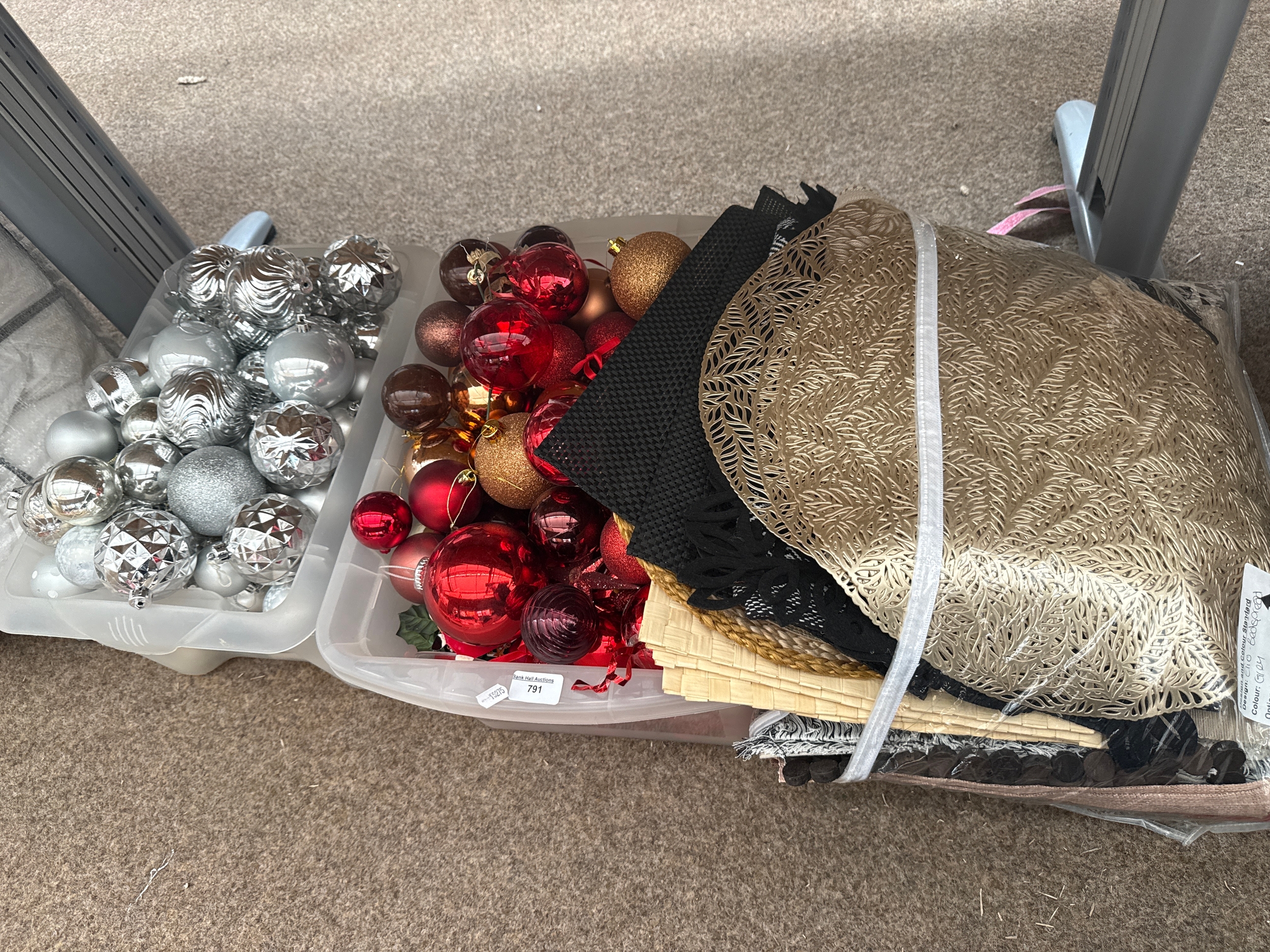 Two boxes of Christmas decorations and a bag of various materials