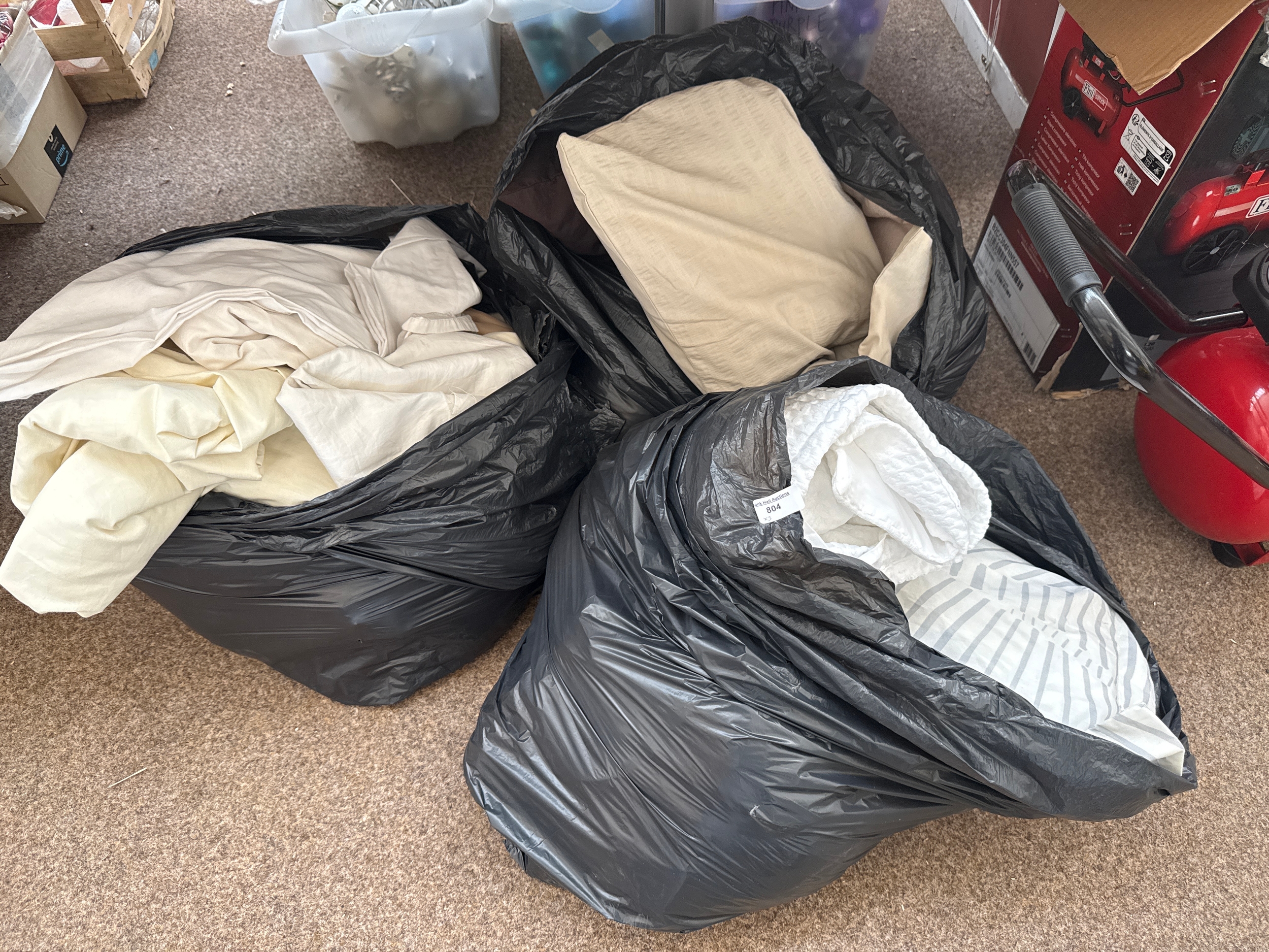 Three bags of bed sheets