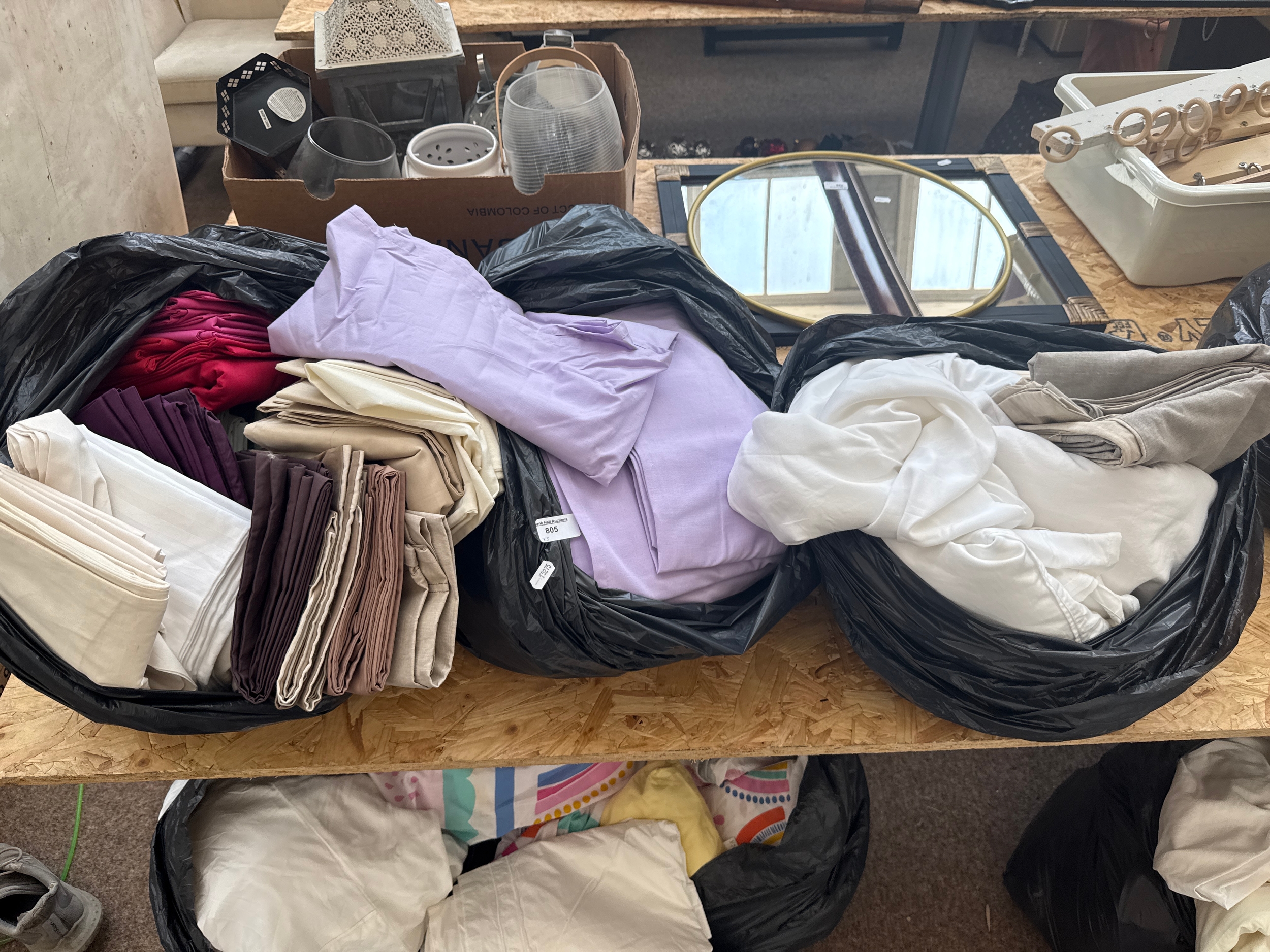 Three bags of bed sheets