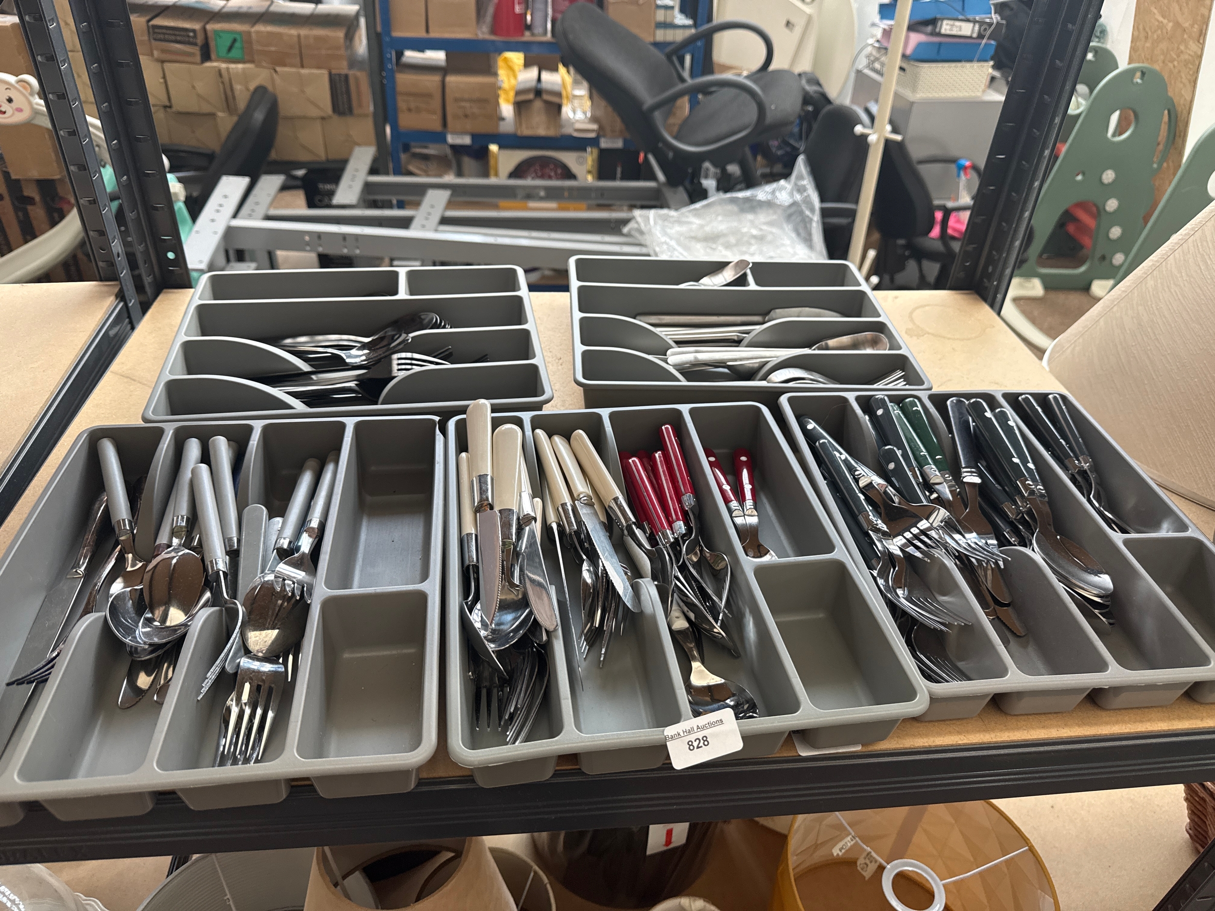 Five trays of cutlery