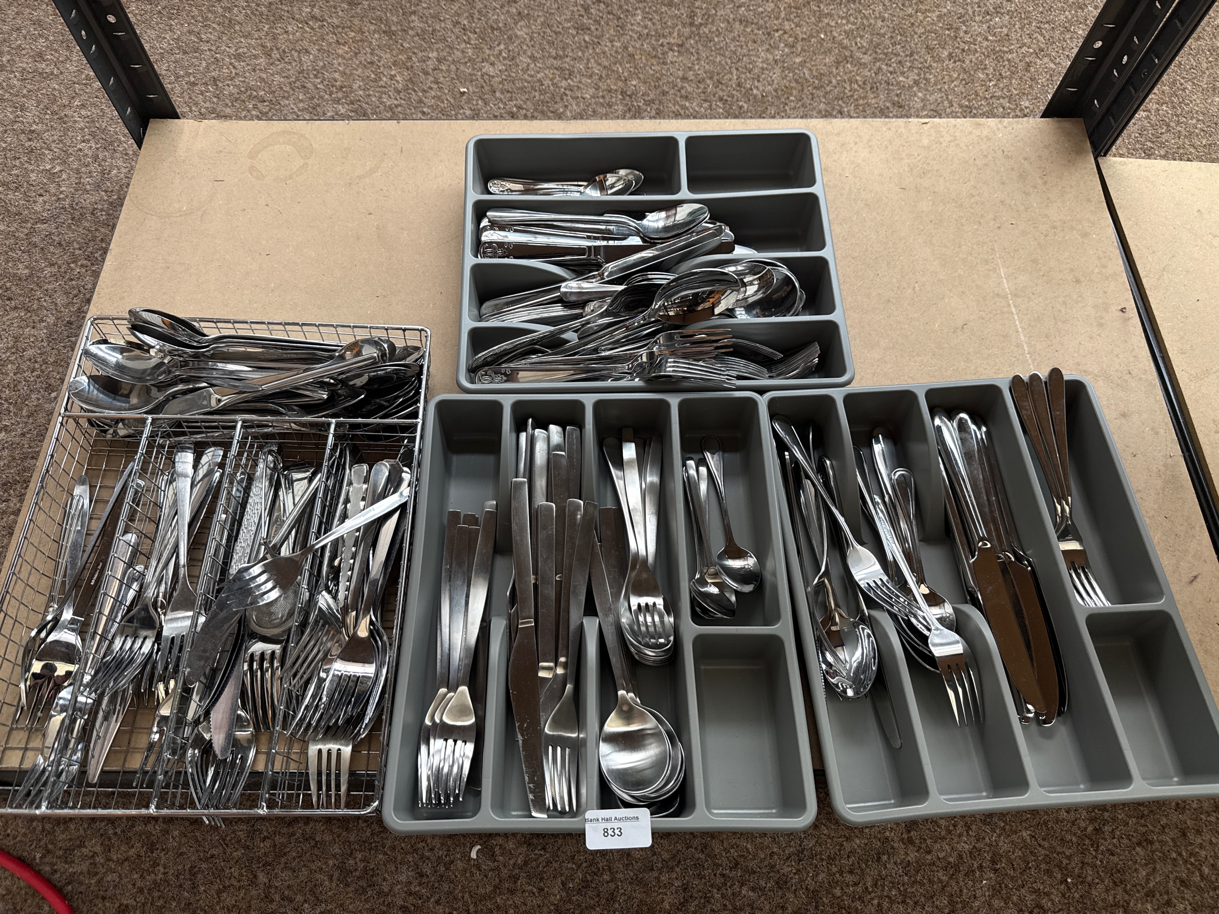 Four trays of cutlery