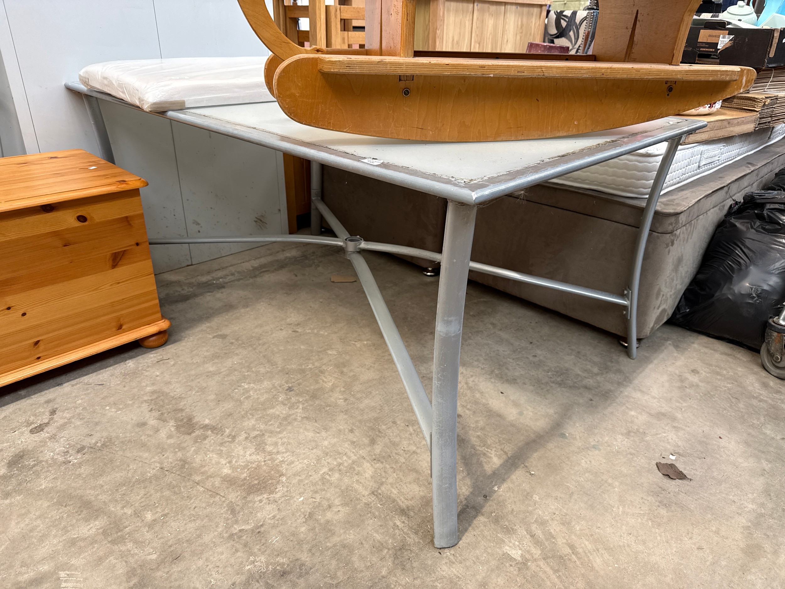 A large metal framed patio table
