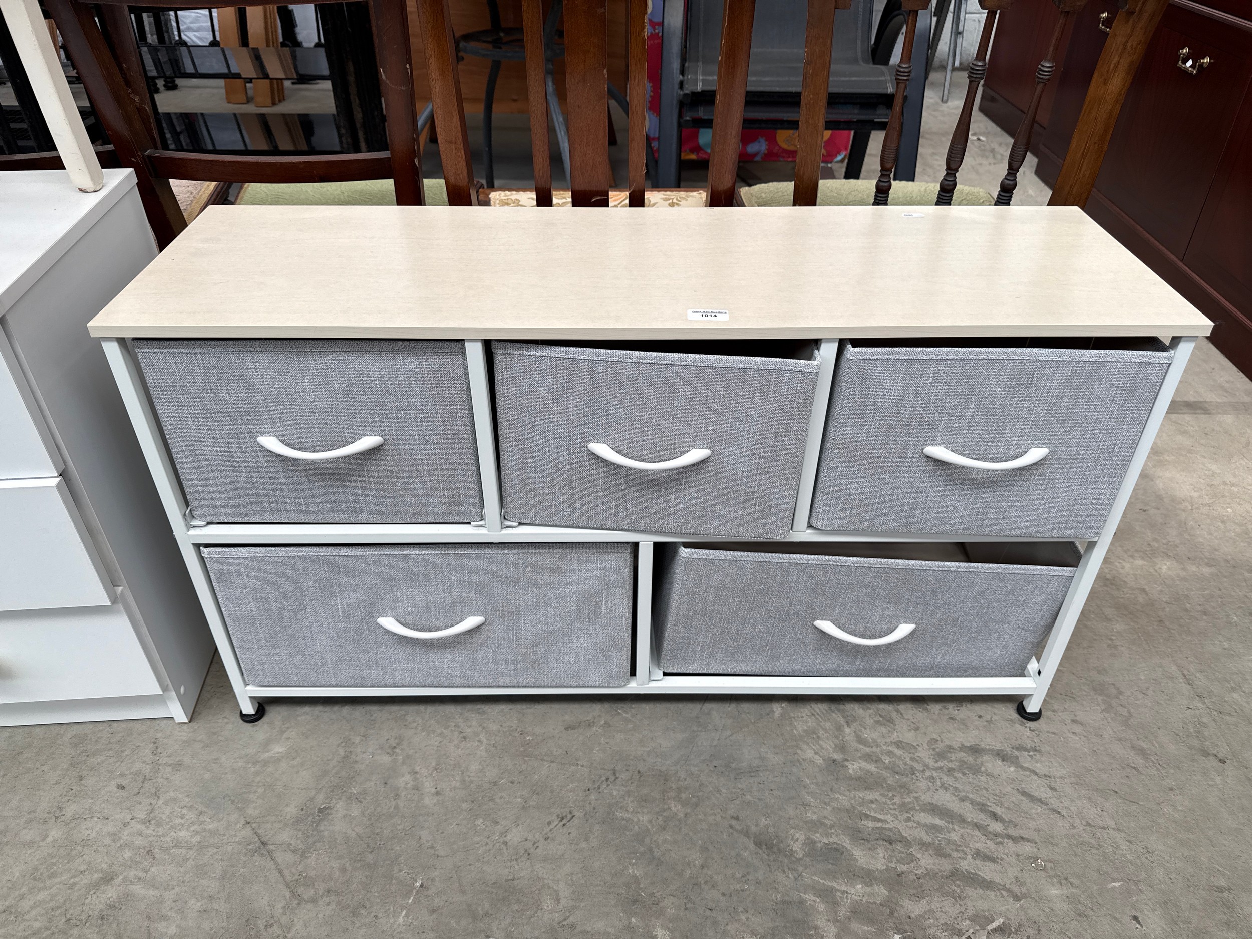 A small storage stand with 5 x canvas box drawers