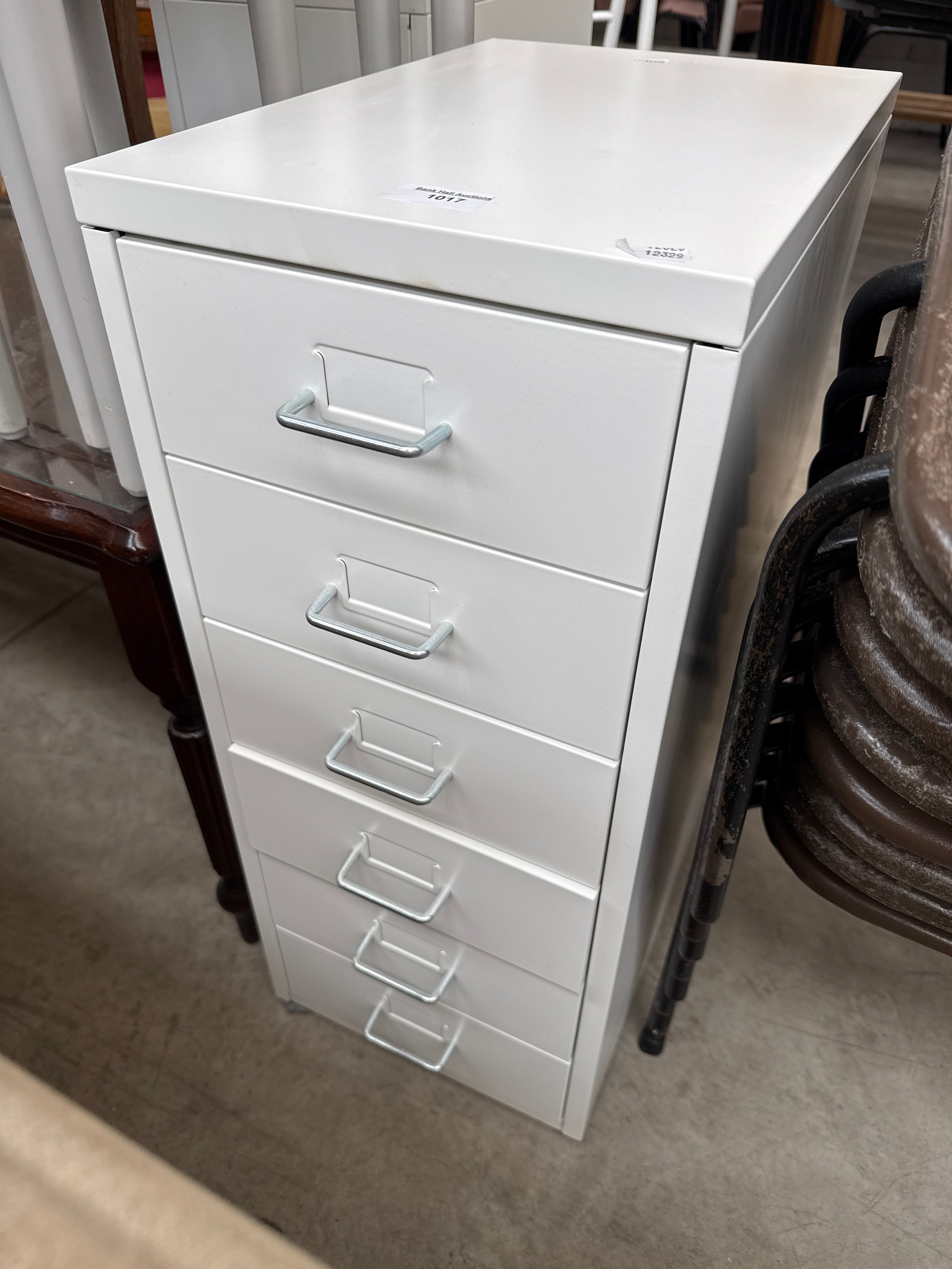 A small metal 6 drawer chest