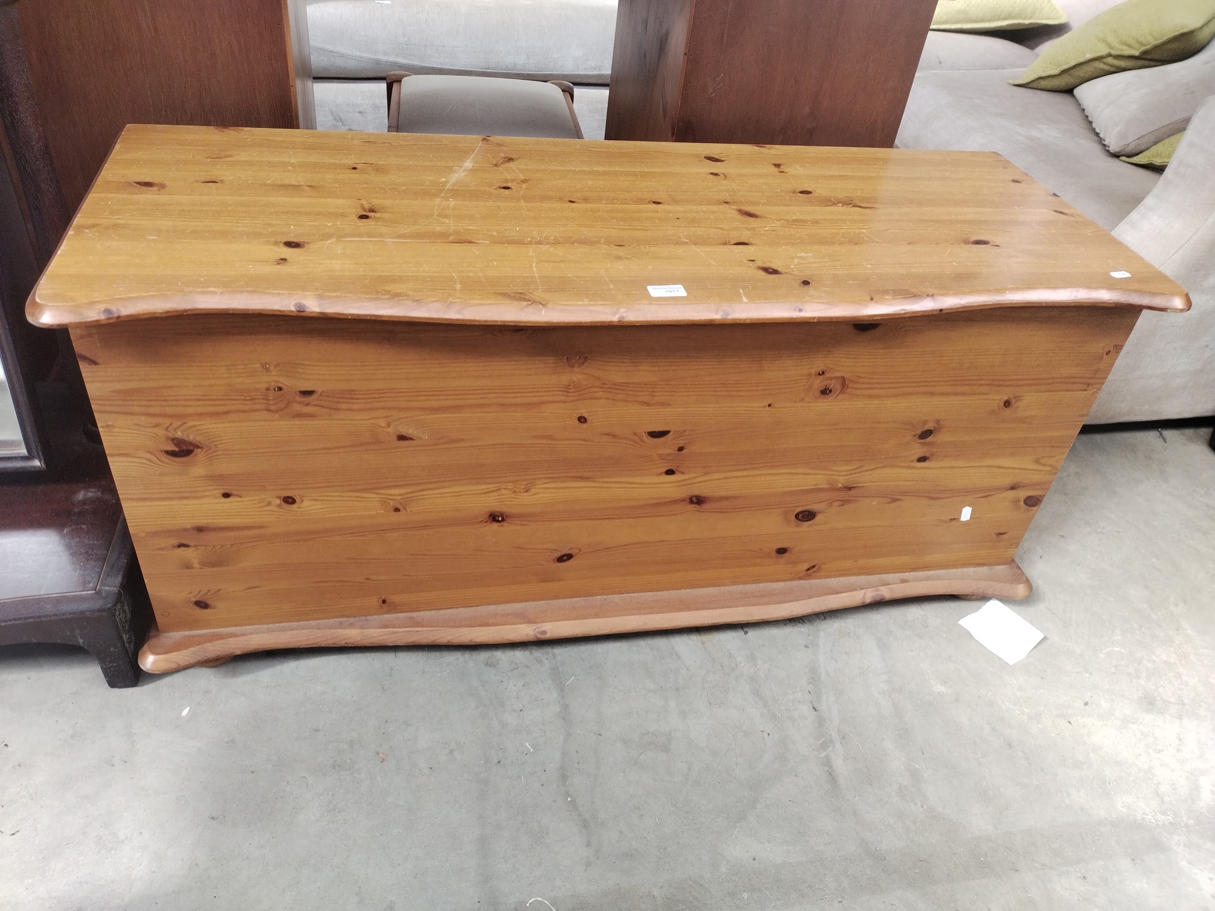 A vintage pine lift top storage box