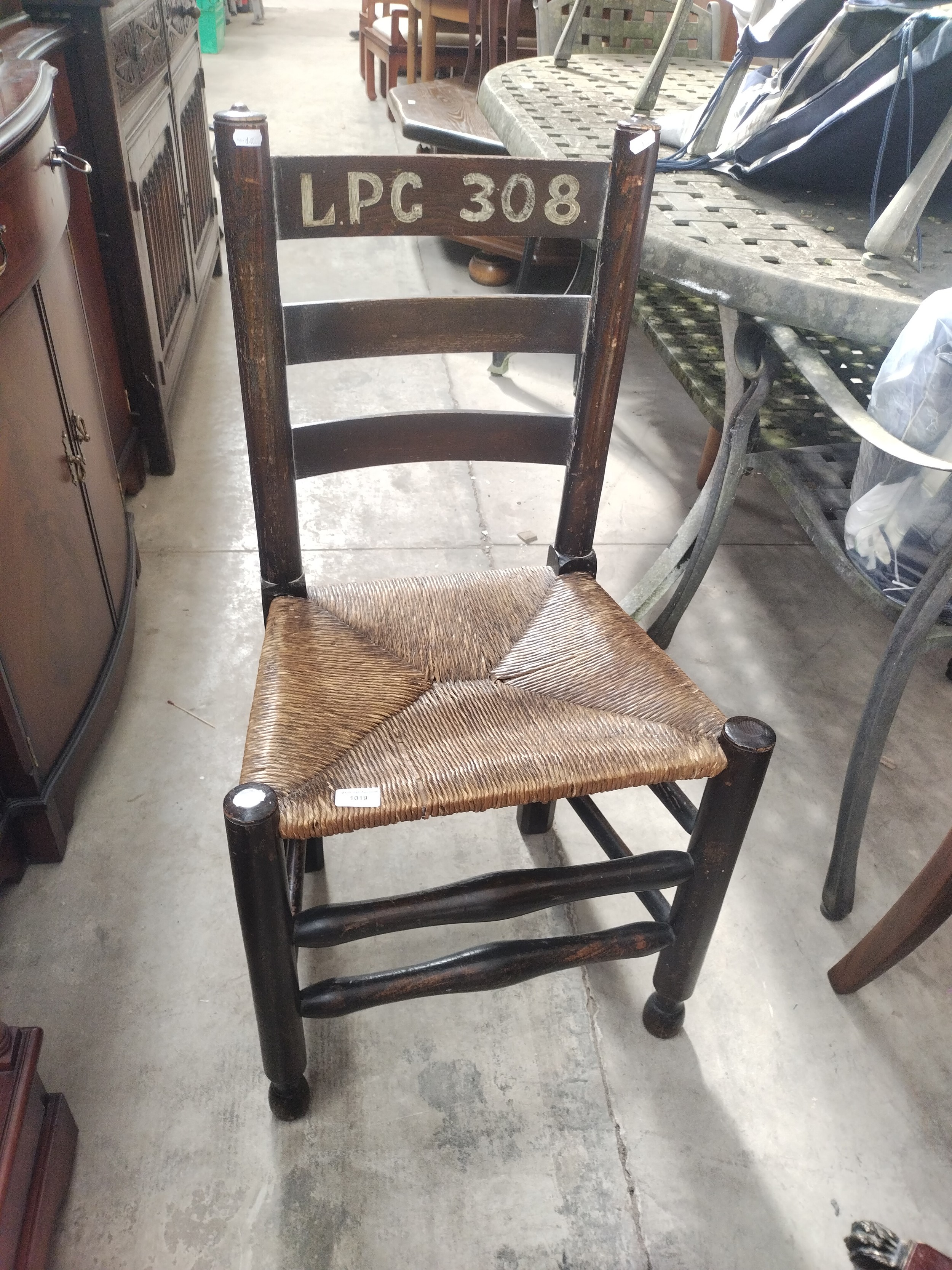 A vintage rush seated ladder back chair