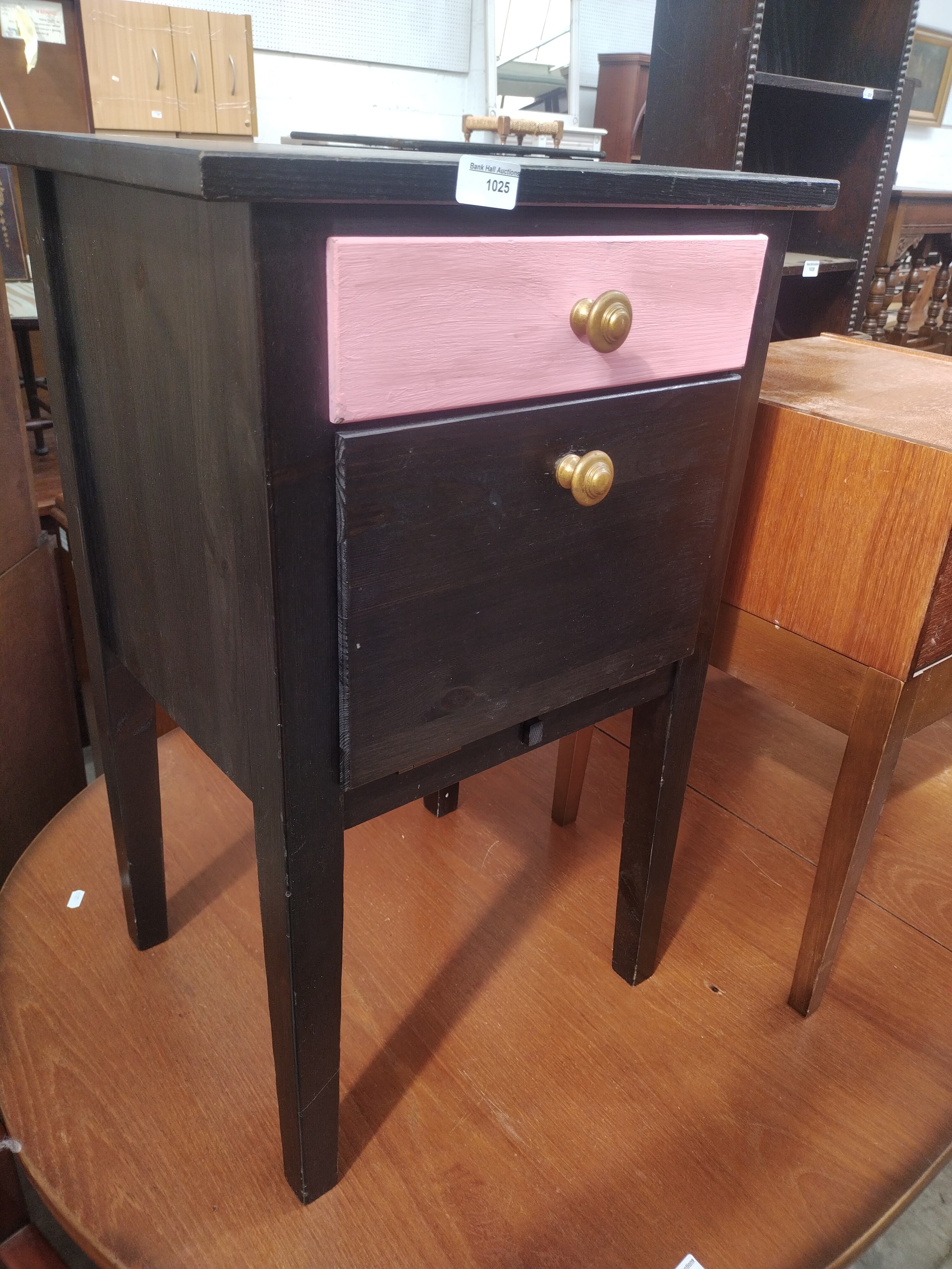 A small upcycled bedside cabinet with drawer