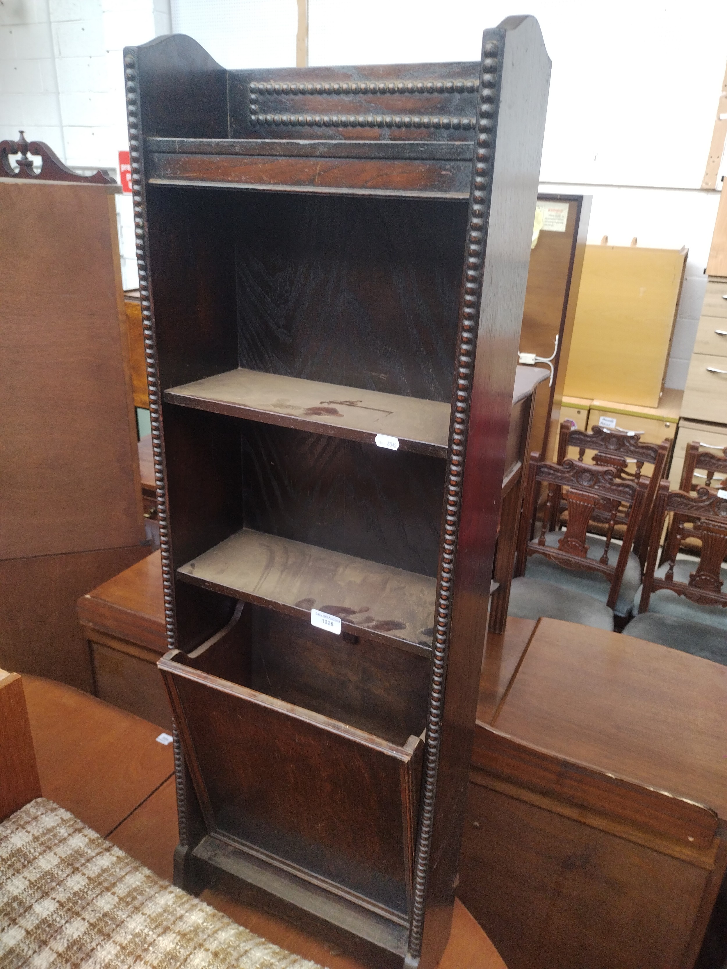 A small vintage beaded oak shelf stand with tilting lower magazine rack