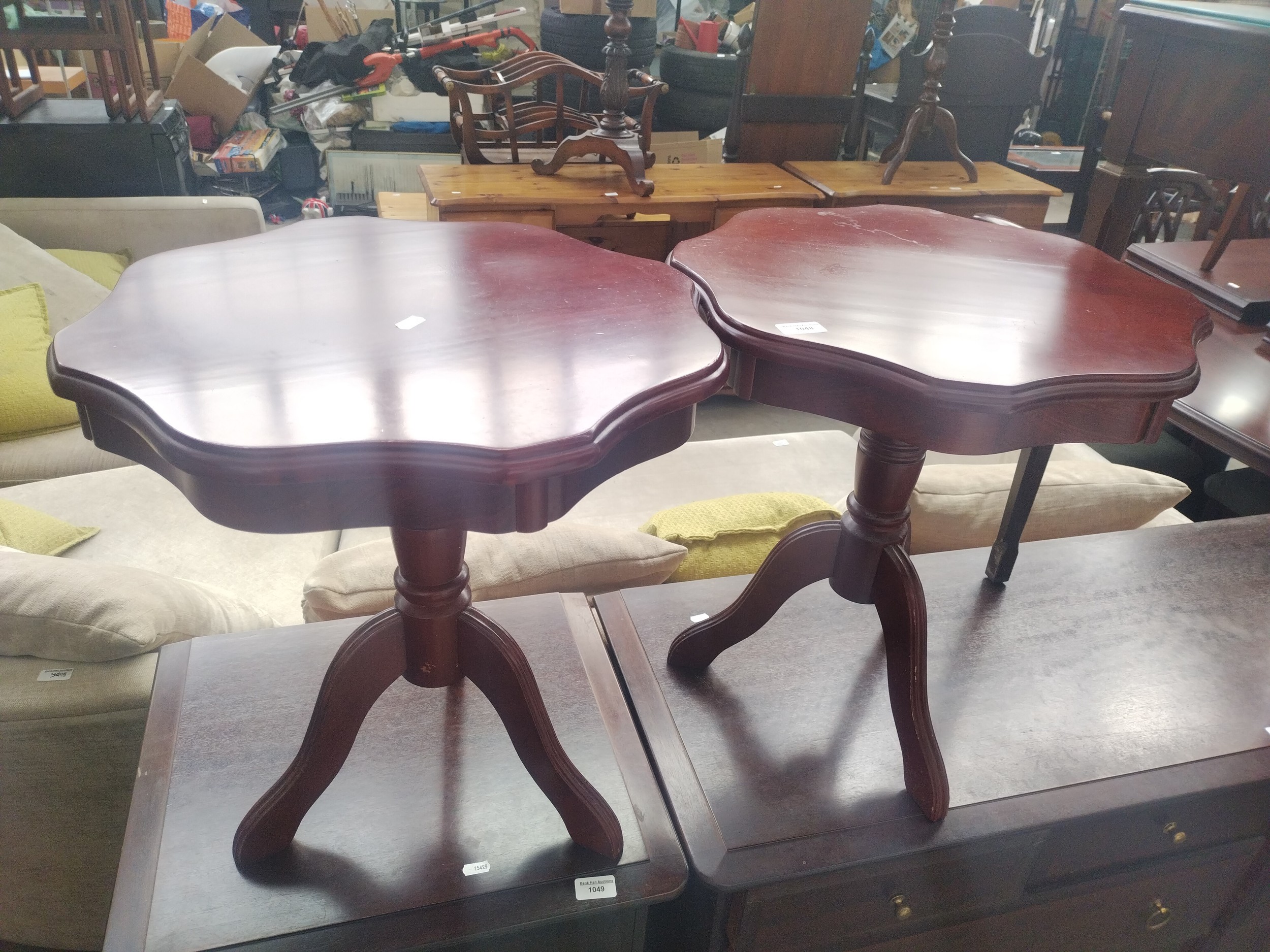 A pair of small vintage tripod tables