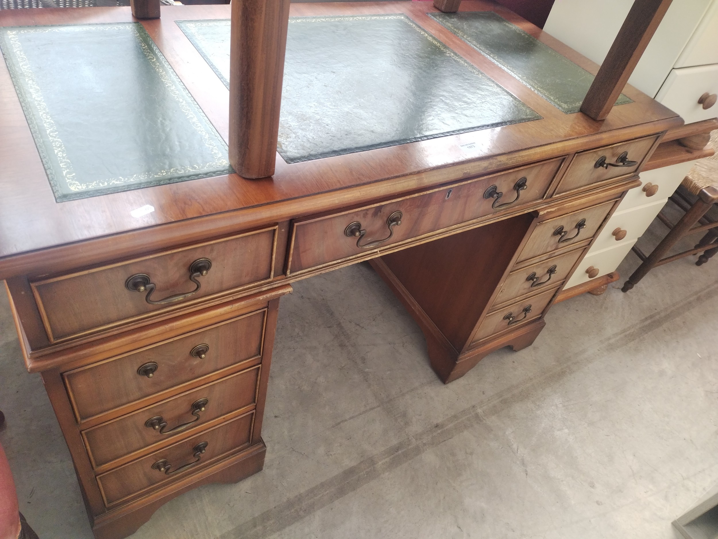 A vintage leather topped twin pedestal desk with 6 x drawers and lockable