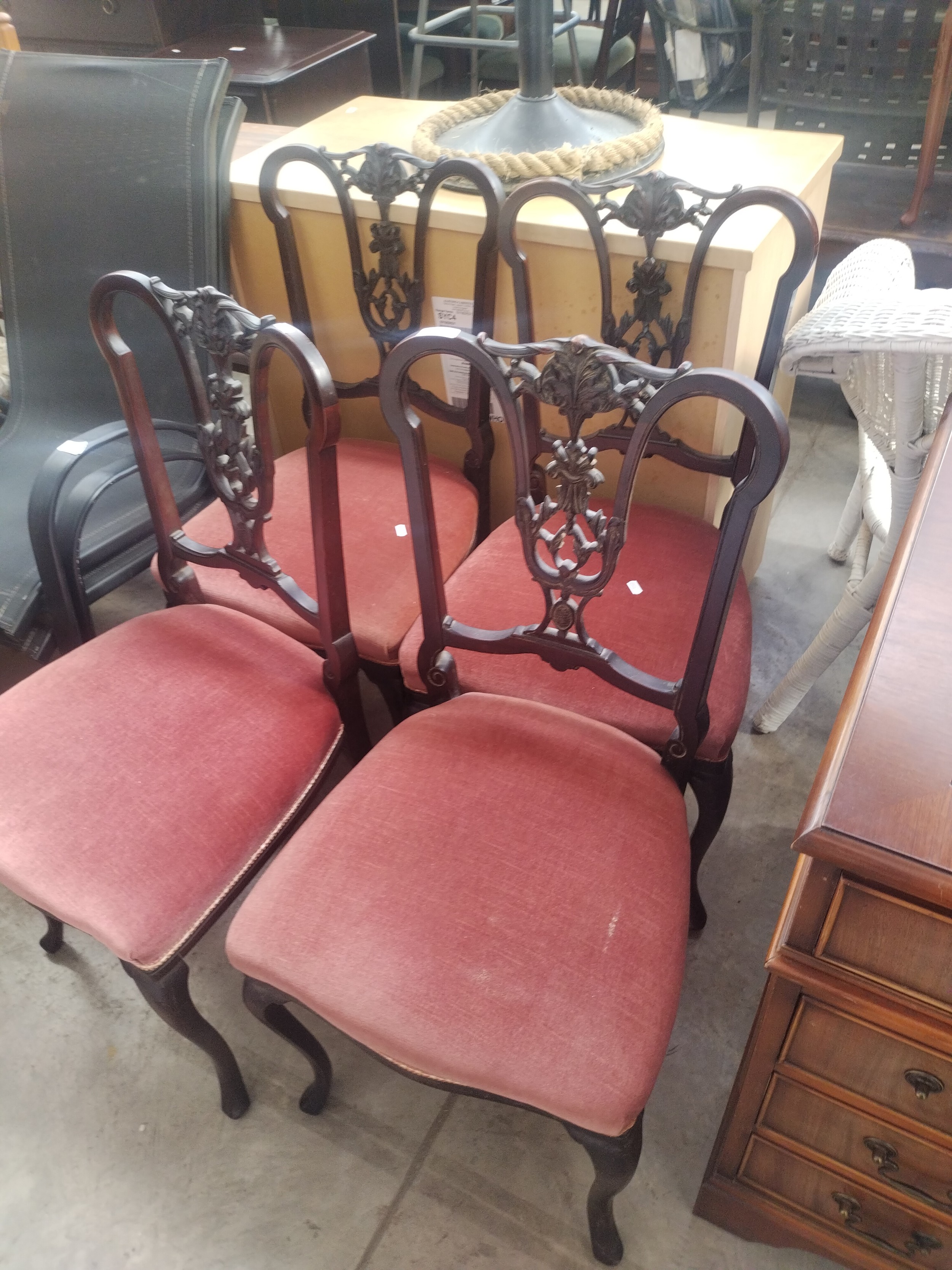 A set of 4 x ornately carved Edwardian dining chairs