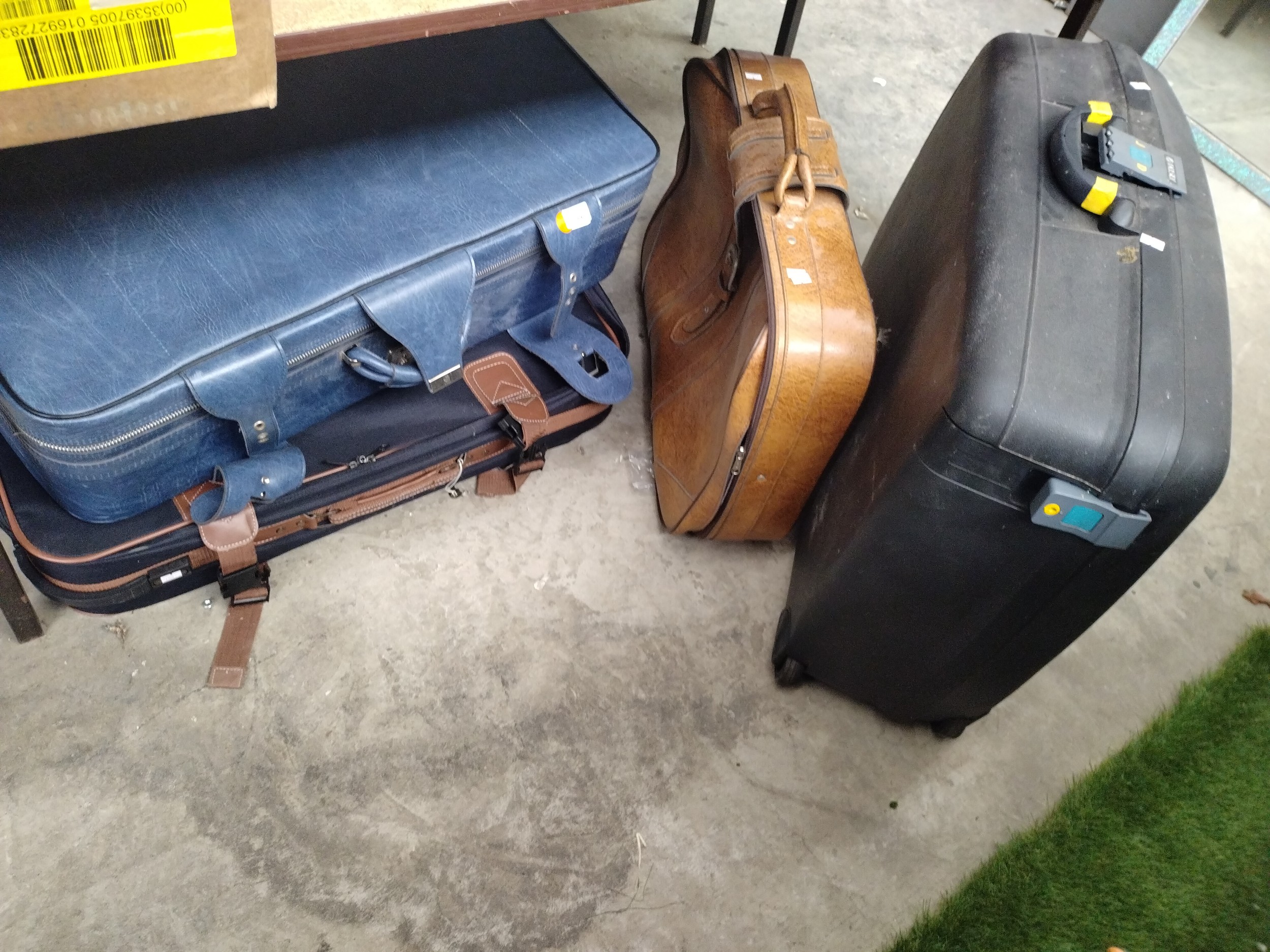 Four assorted suitcases