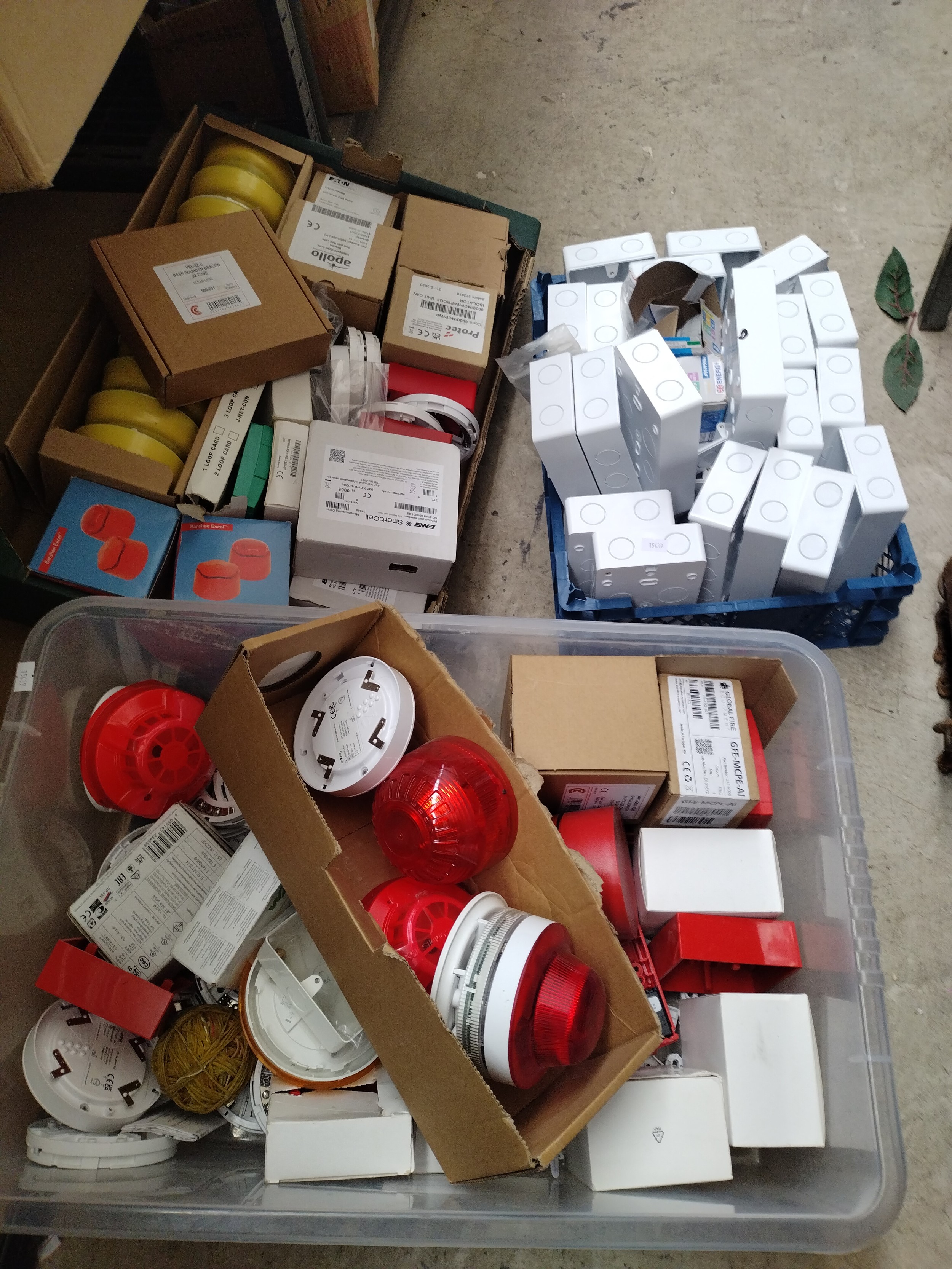 Two boxes of fire safety hardware