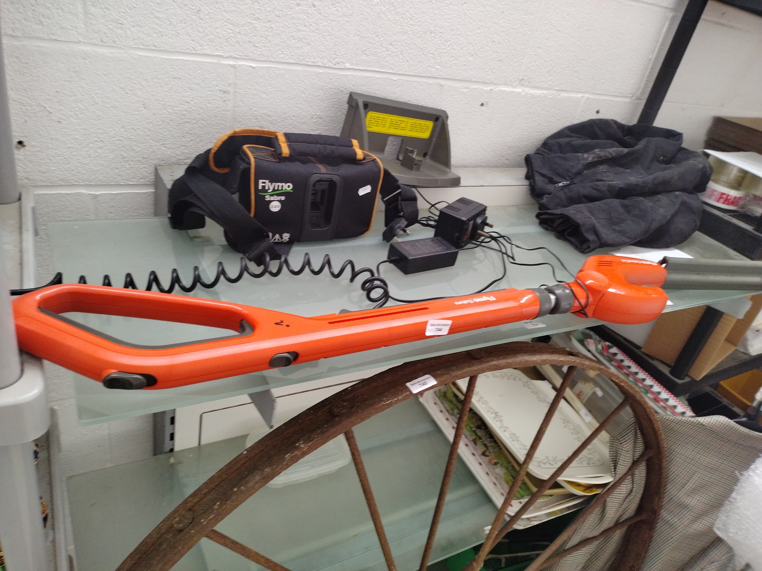 Flymo cordless hedge trimmer with charger and battery pack