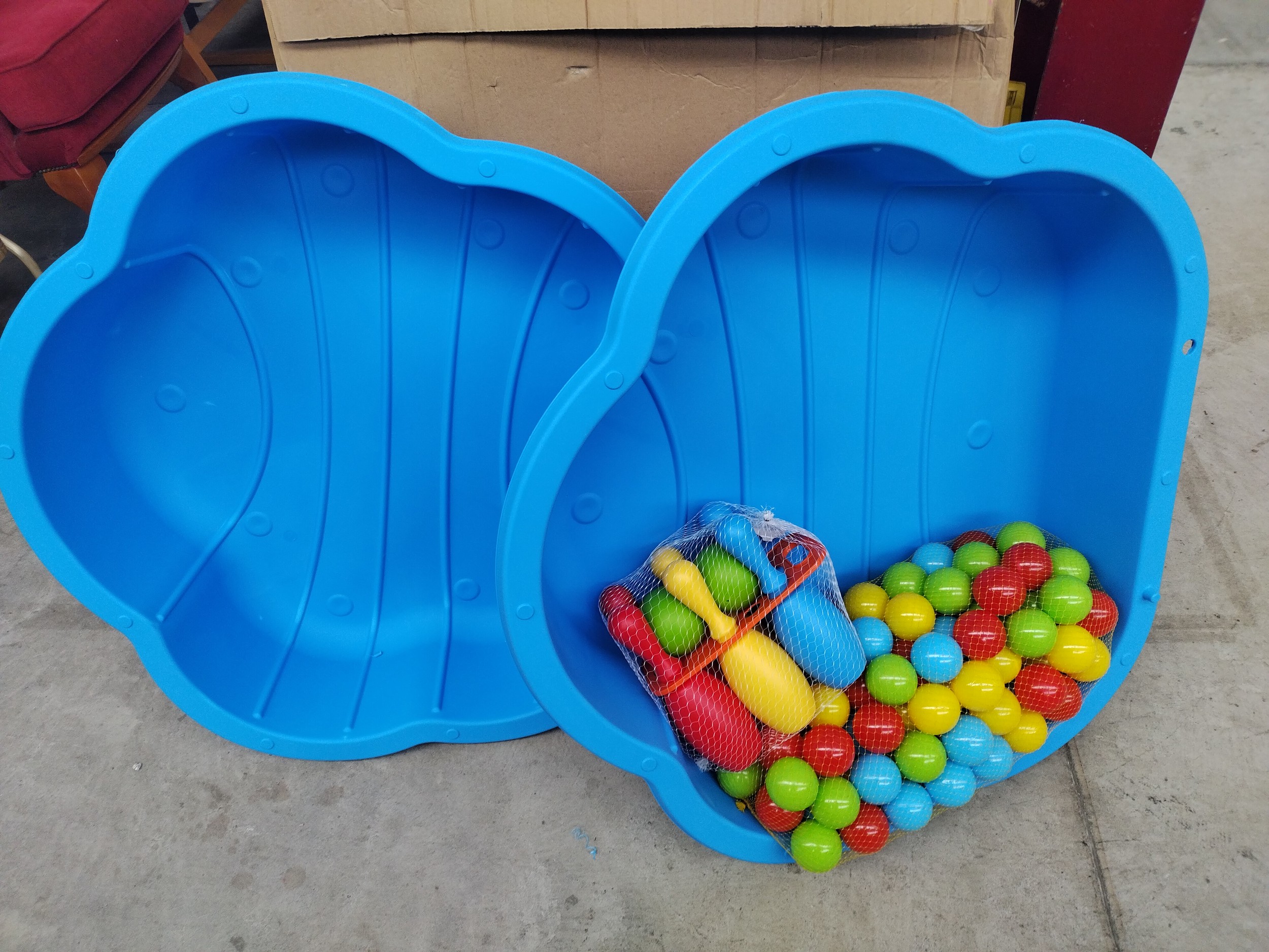 Two plastic ball pits with balls