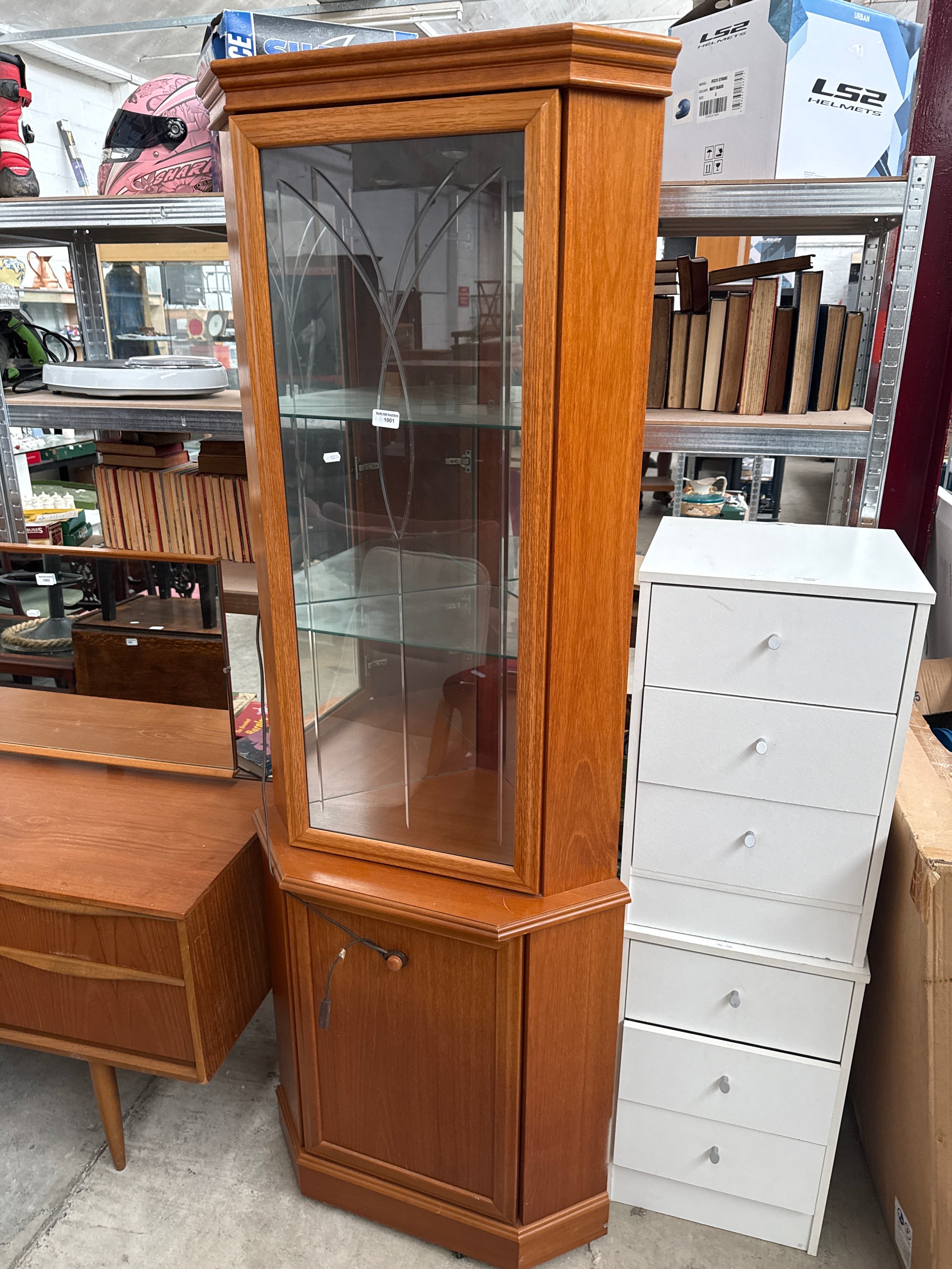 A vintage glazed corner cabinet
