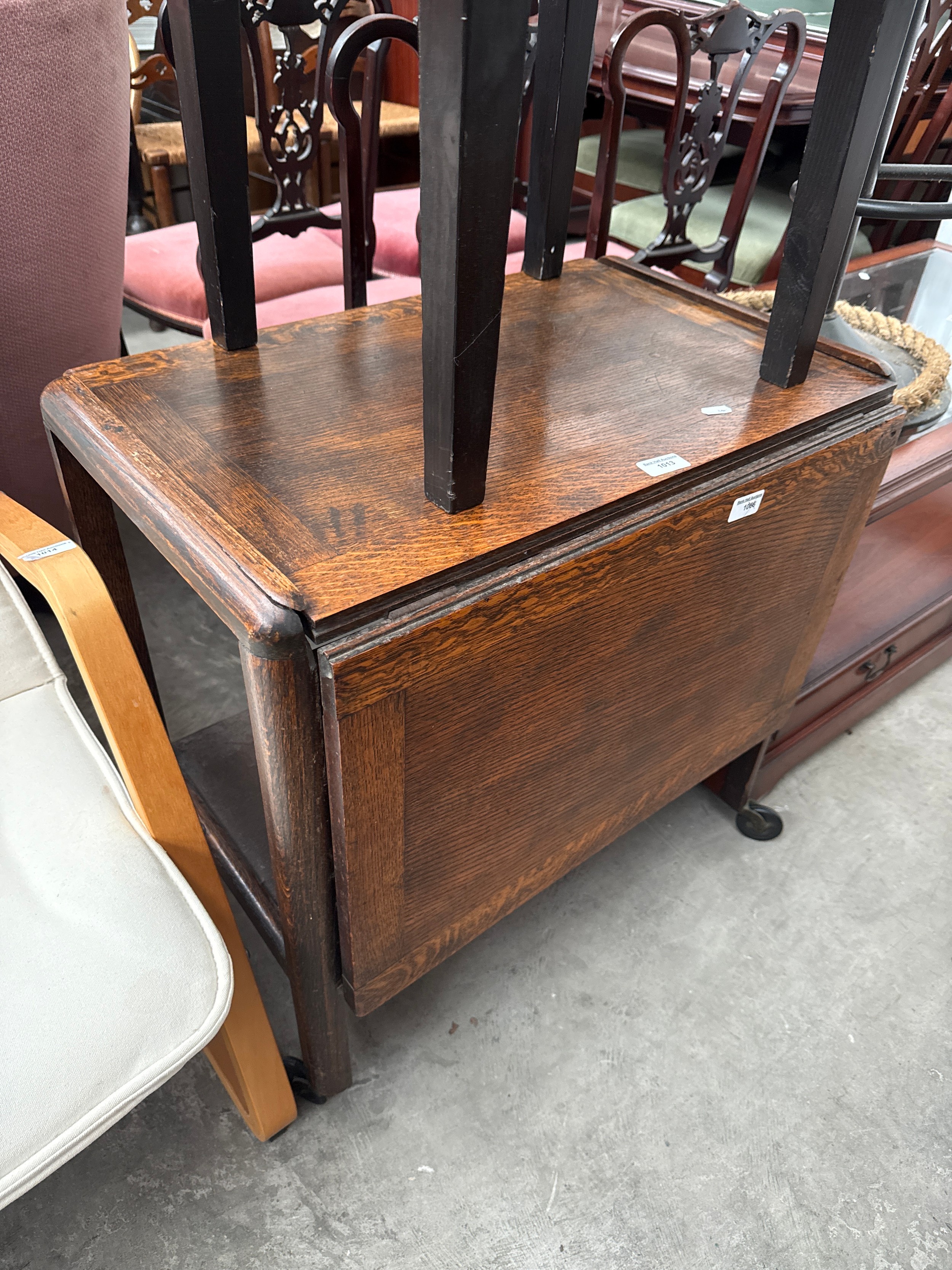 A vintage oak extending drop leaf trolley table