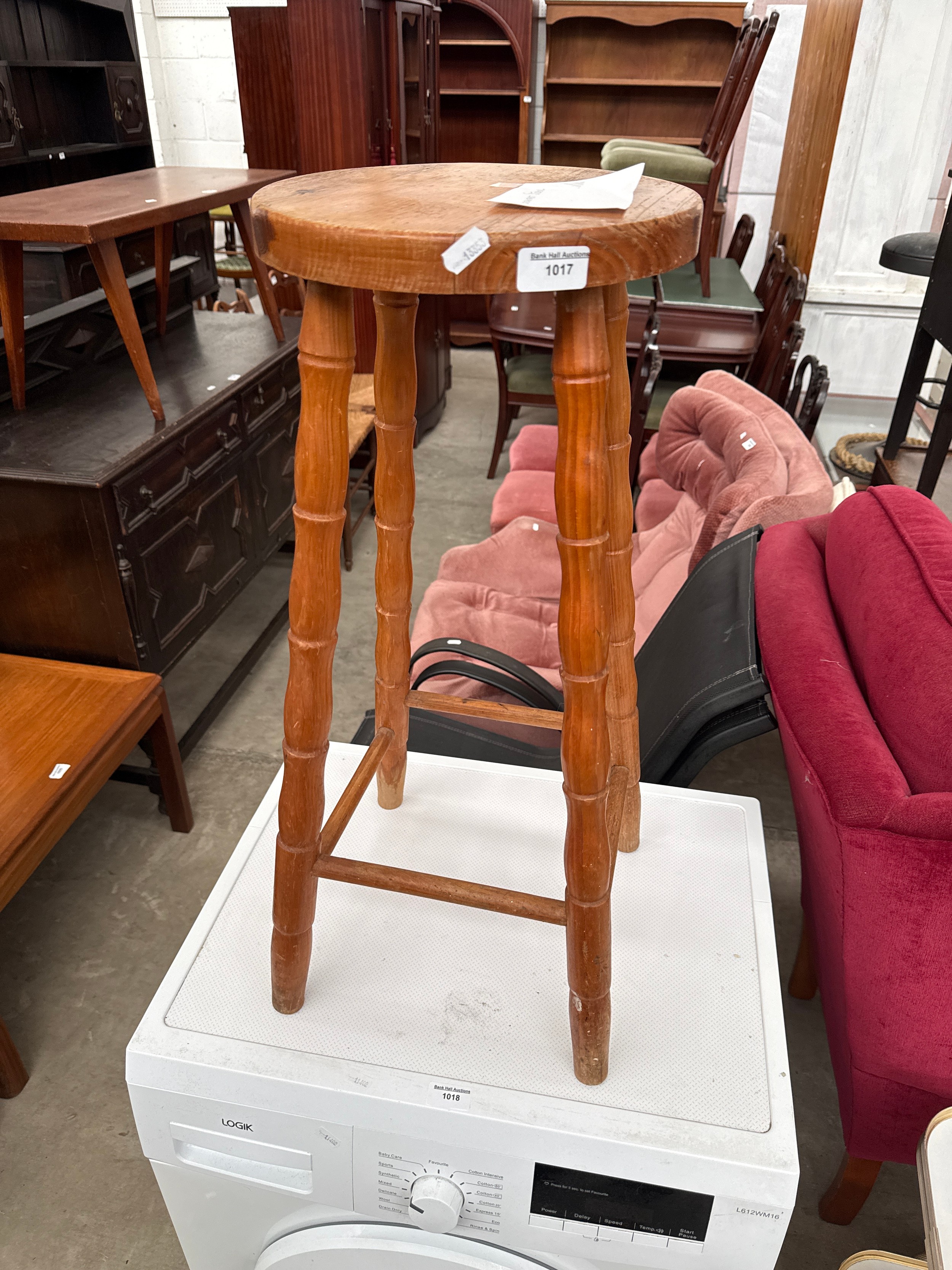 A tall vintage breakfast stool
