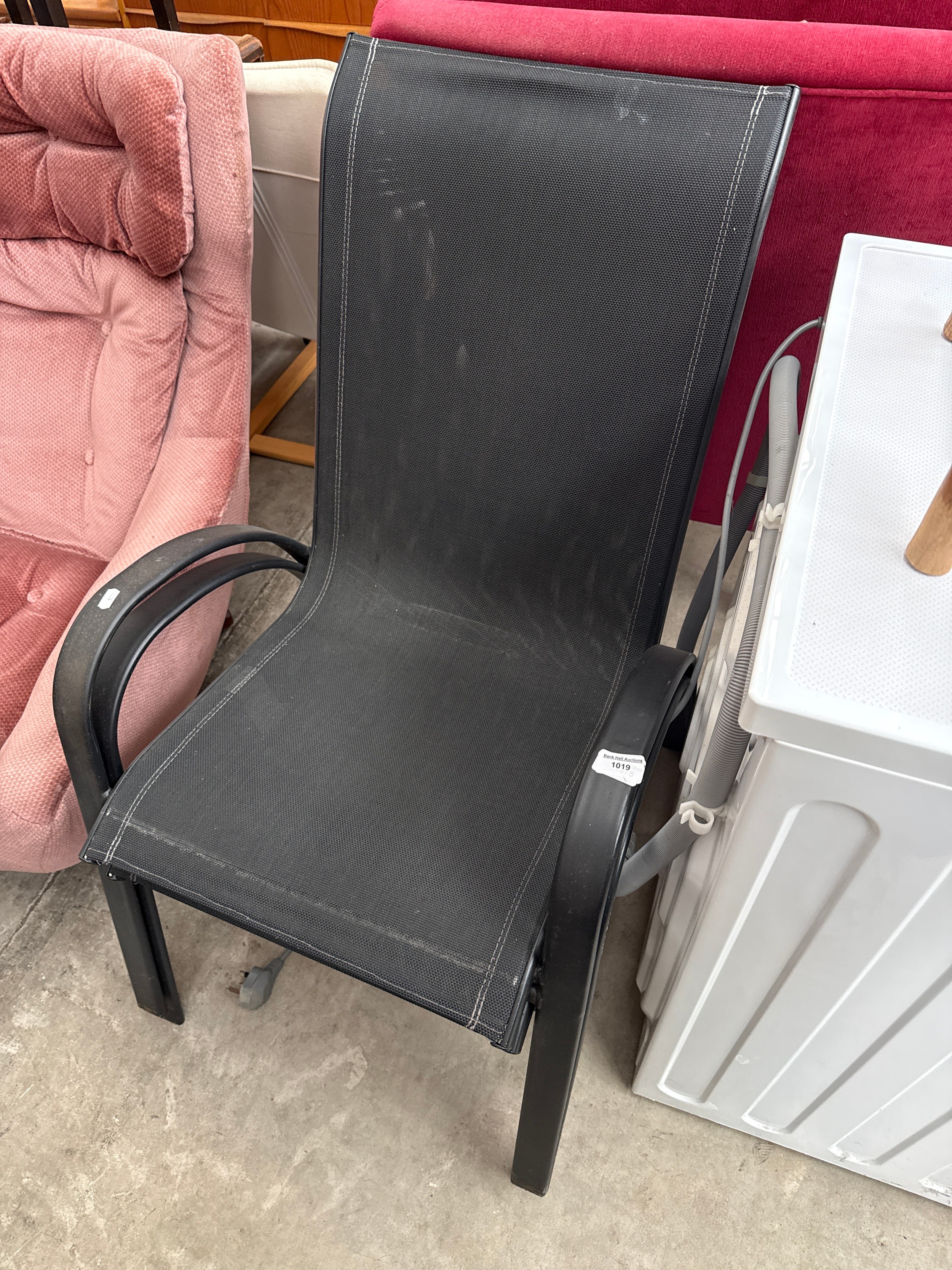 A pair of metal framed patio chairs