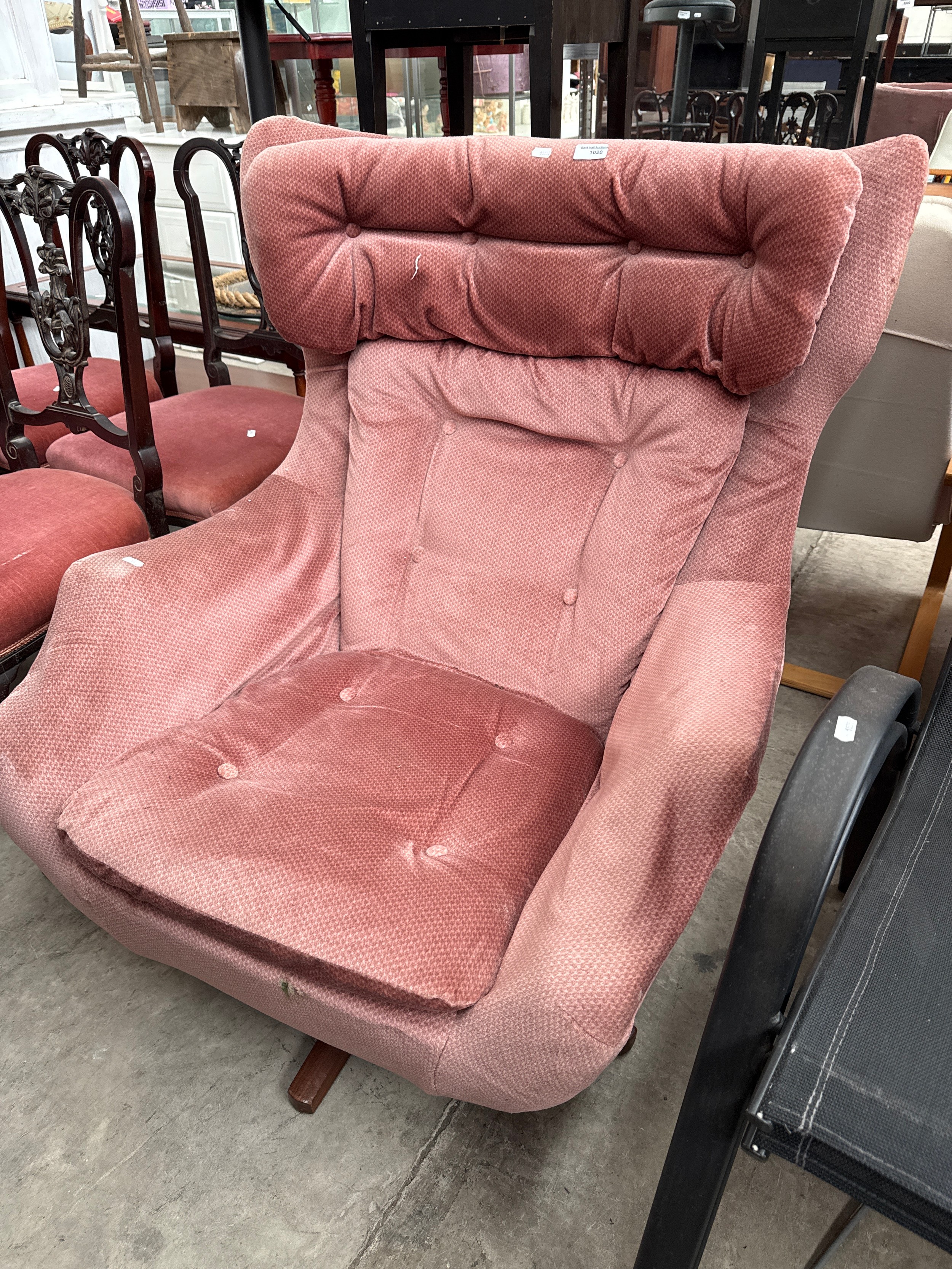 An upholstered rocking armchair