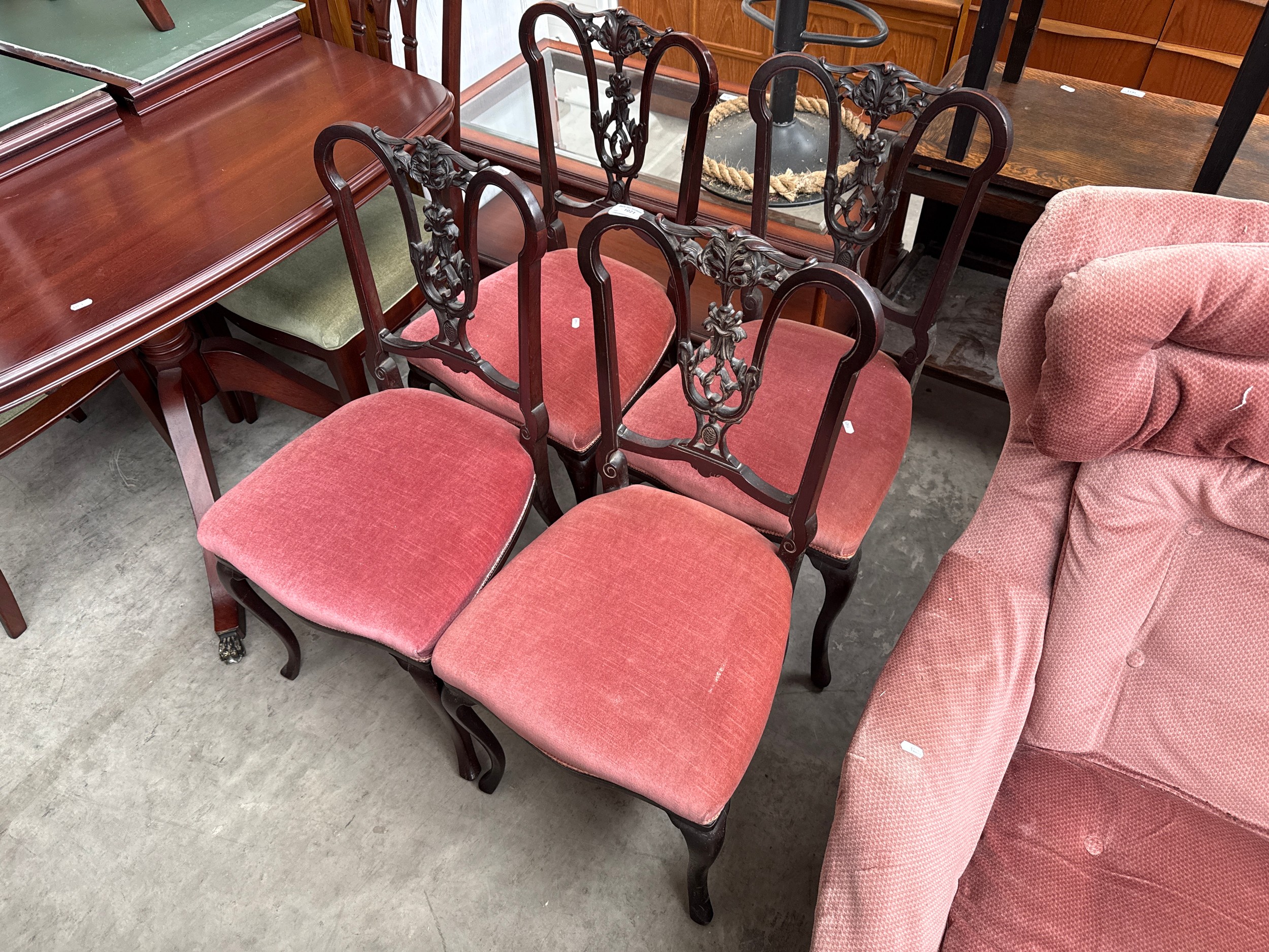 A set of 4 x ornately carved Edwardian dining chairs
