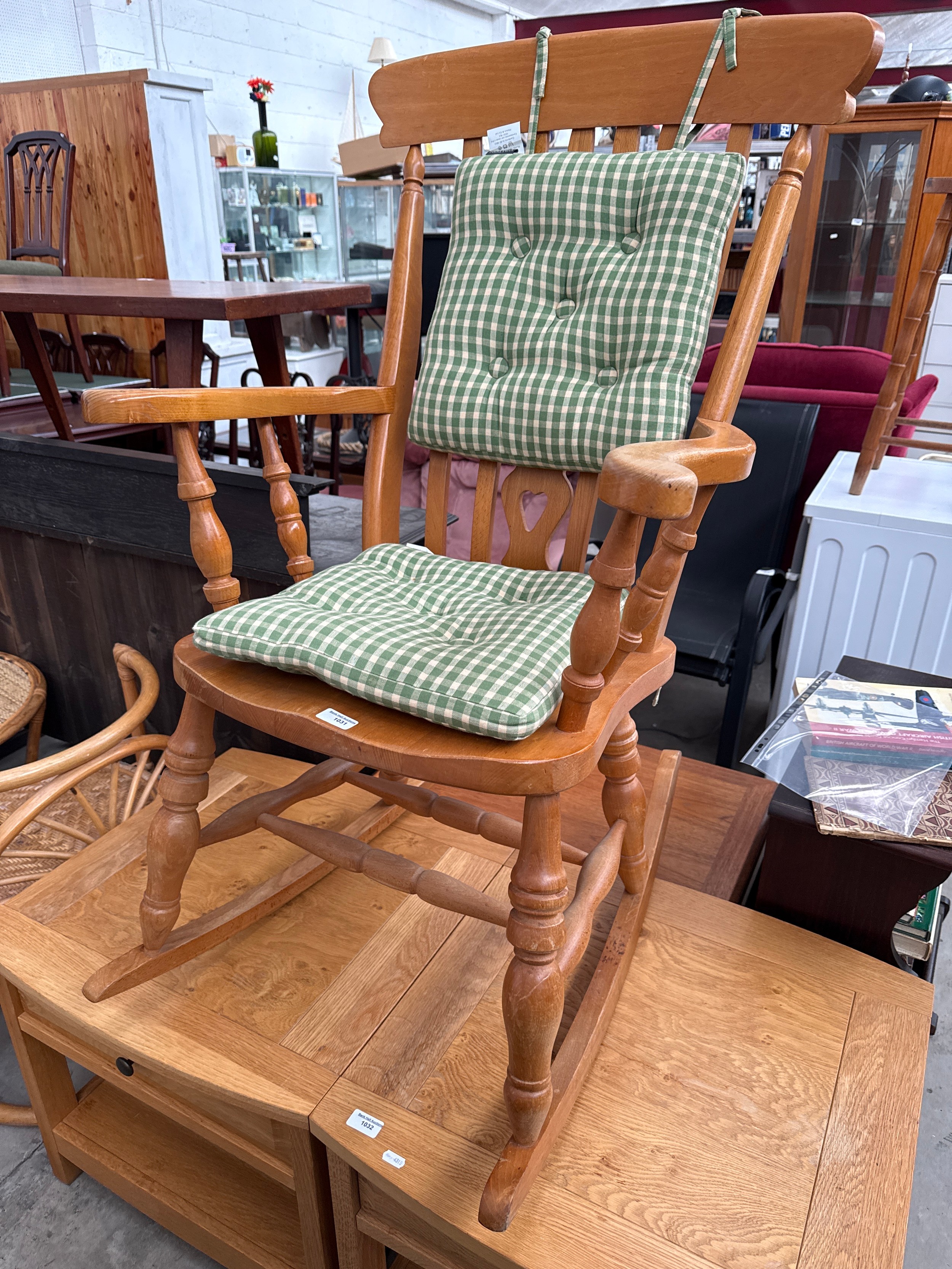 A vintage splat back wooden rocking chair