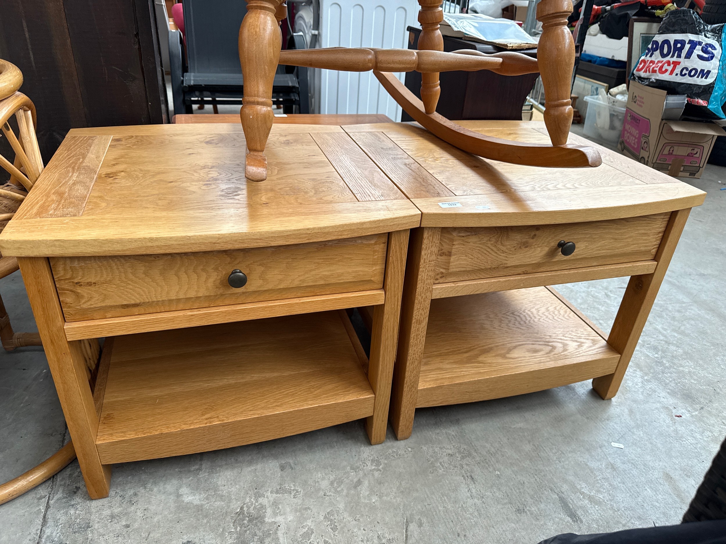 A pair of modern light oak coffee tables with drawers