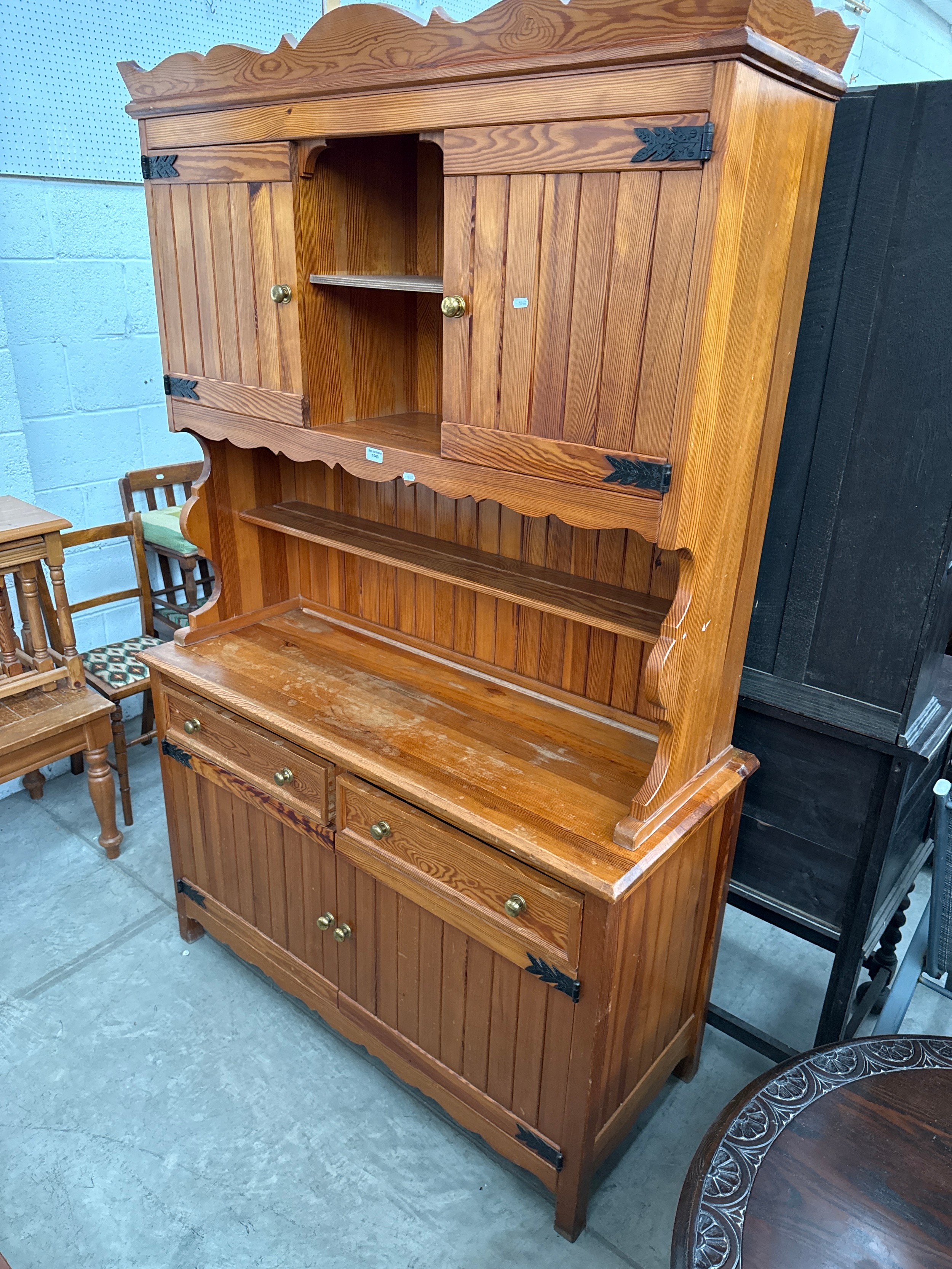 A large vintage pine dresser with 2 x upper cupboards and 2 drawer base