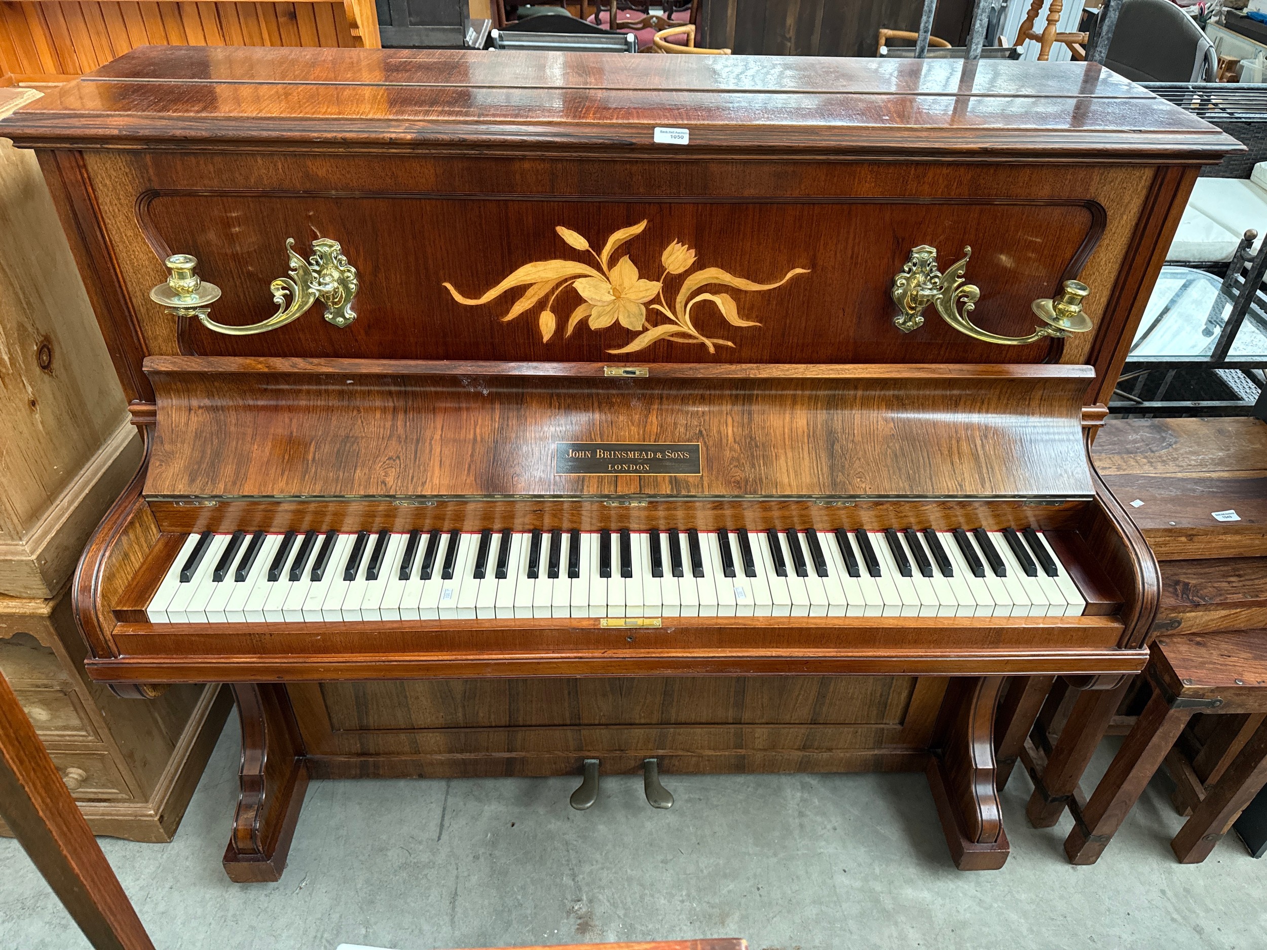 A vintage inlaid upright piano by John Brinsmead & Sons, London