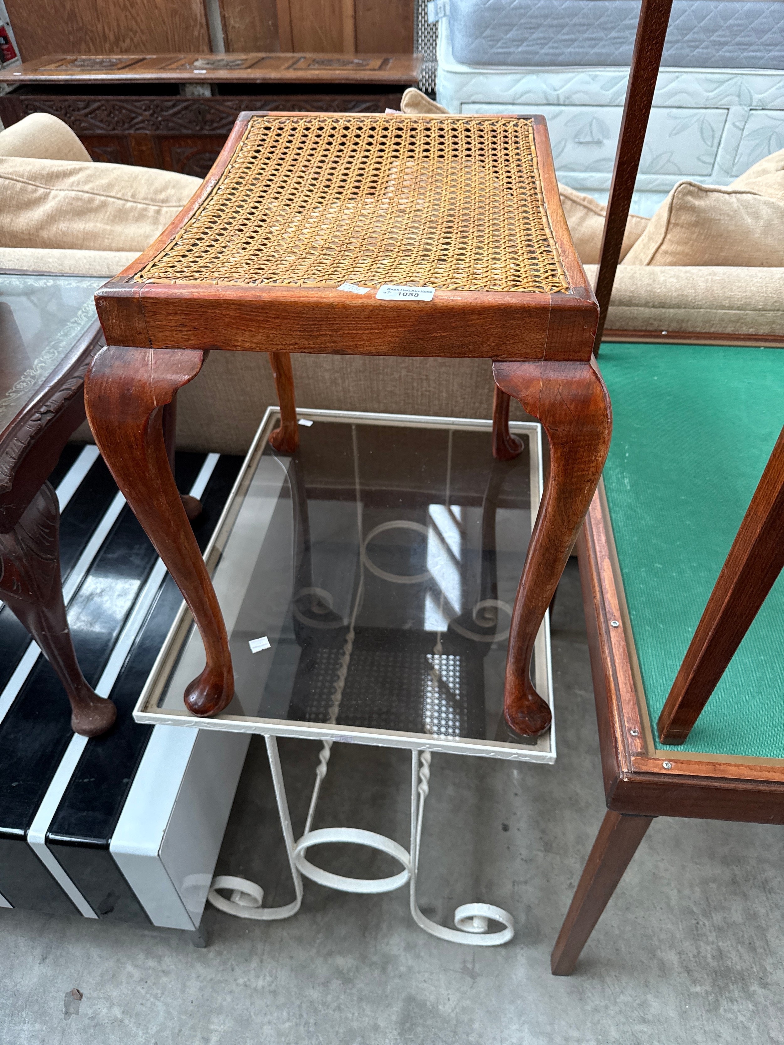 A vintage metal framed glass top table and a rattan seated stool