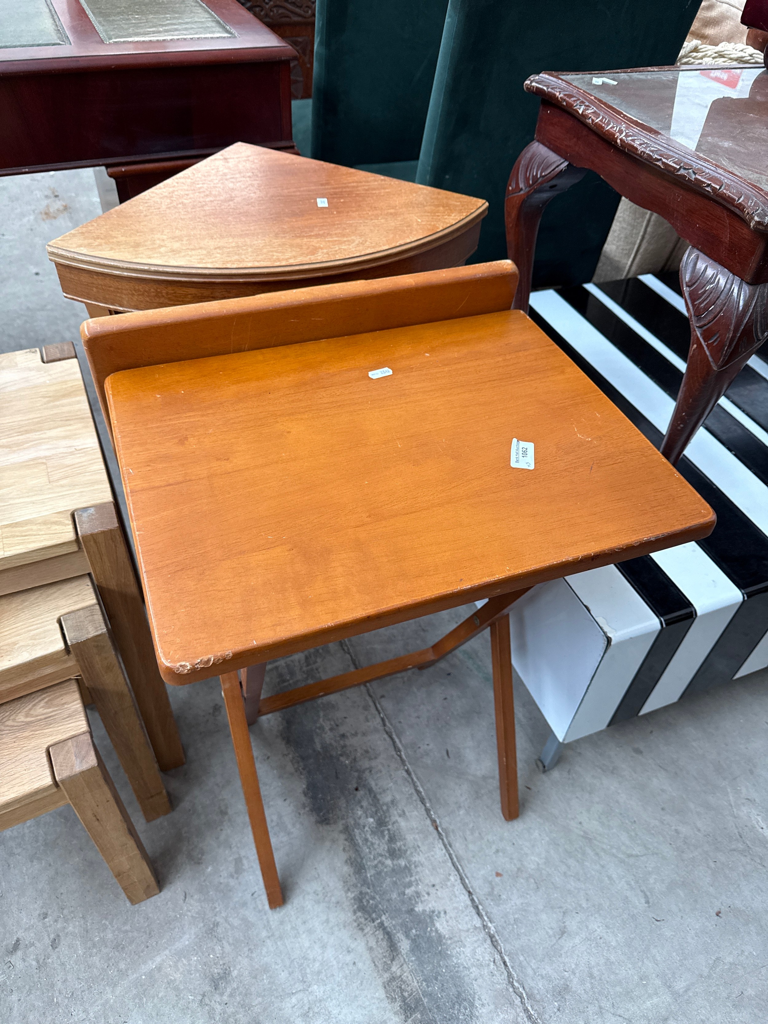 A pair of small folding wooden tables and a small vintage corner table stand