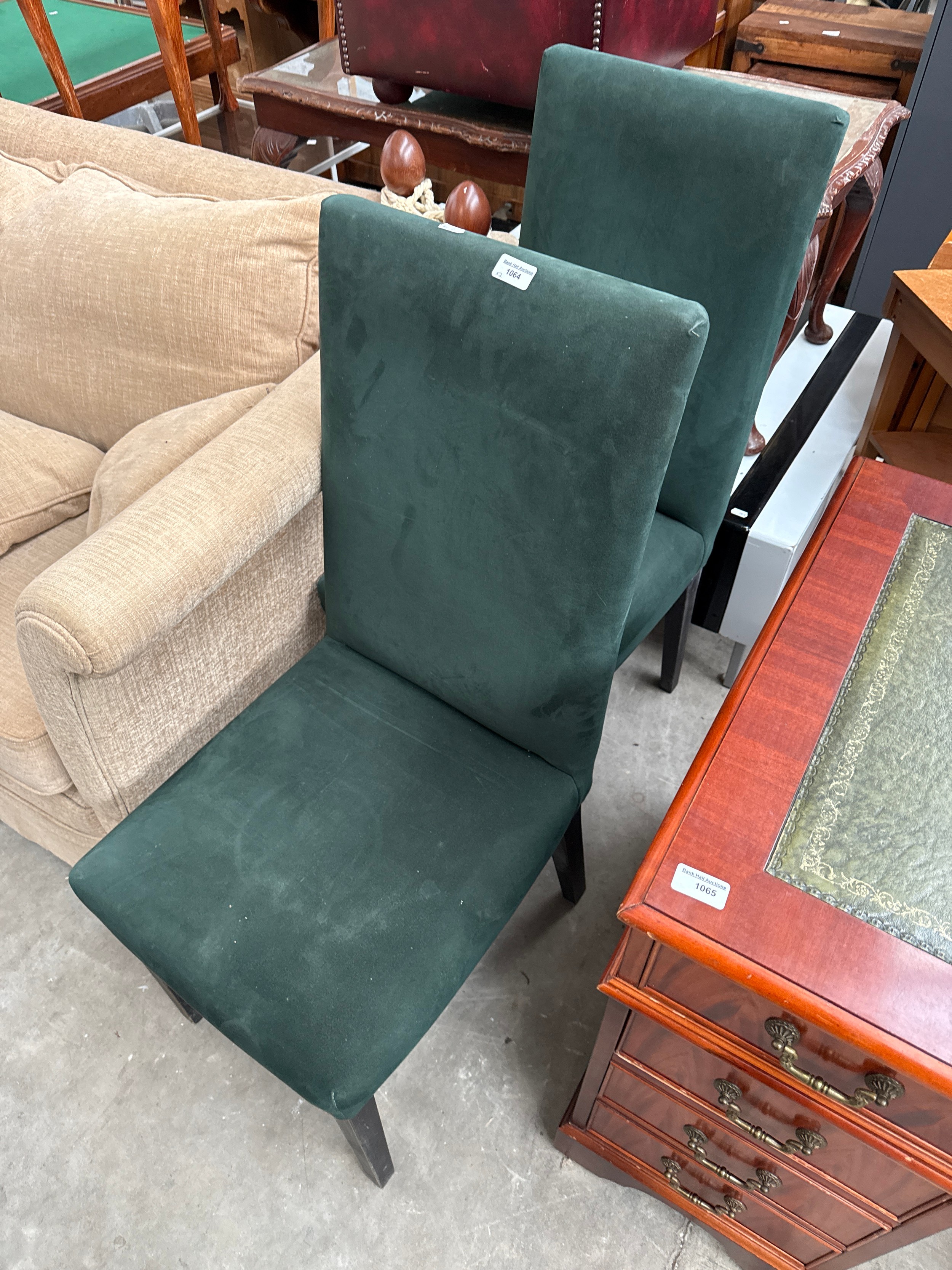 A pair of faux suede high back dining chairs