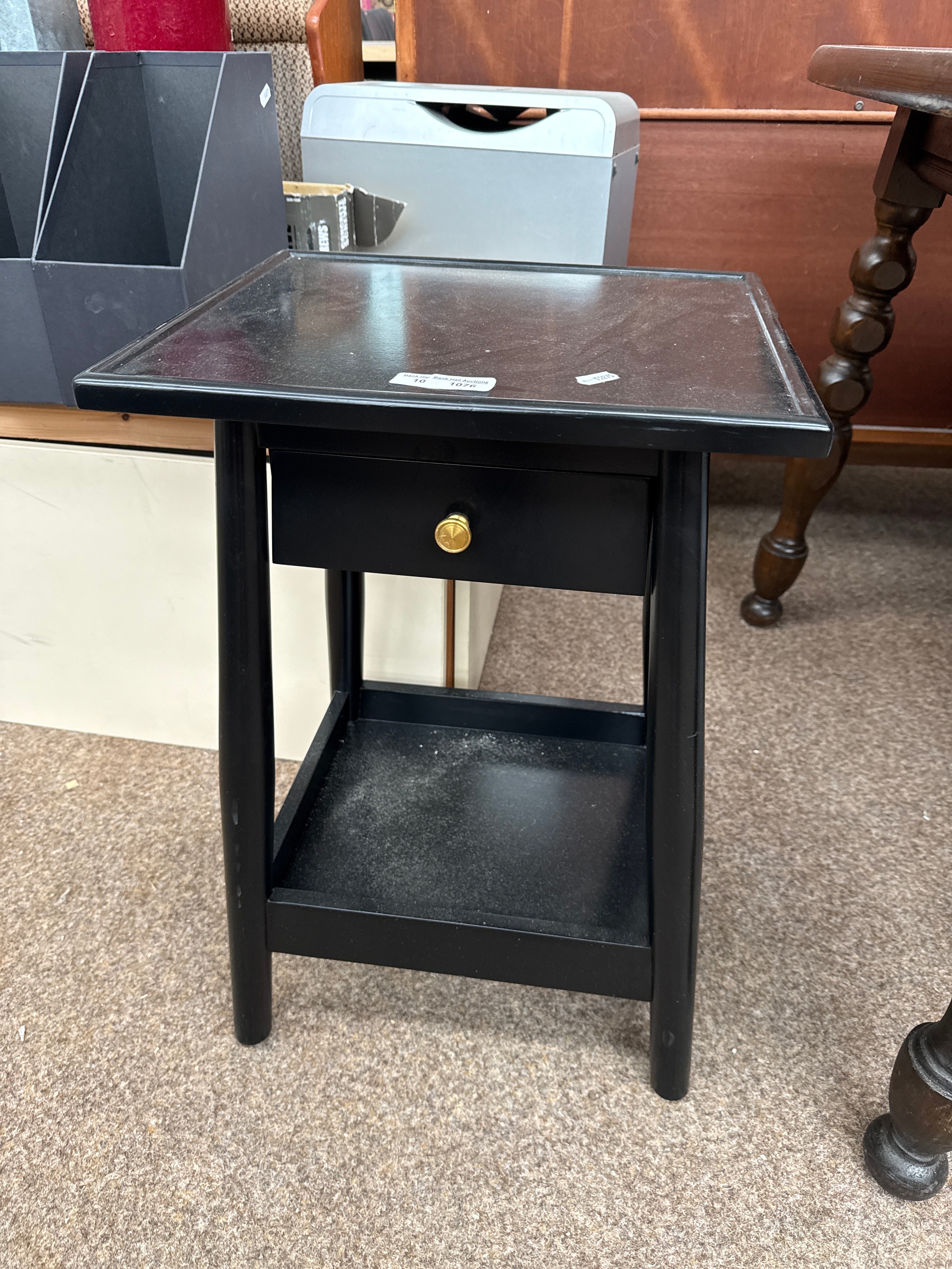 A small black lamp table stand with drawer