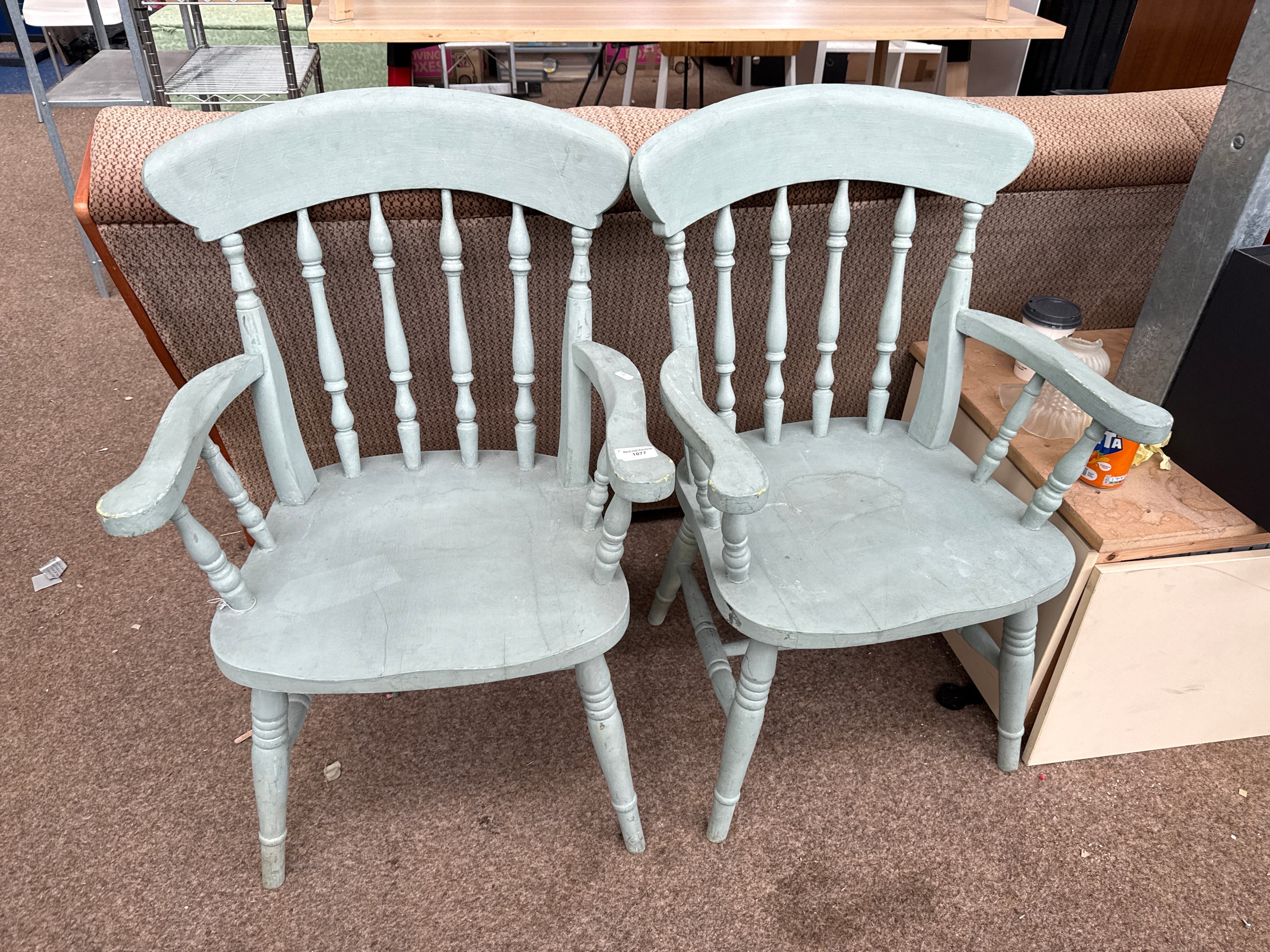 A pair of painted vintage spindle backed kitchen carver chairs