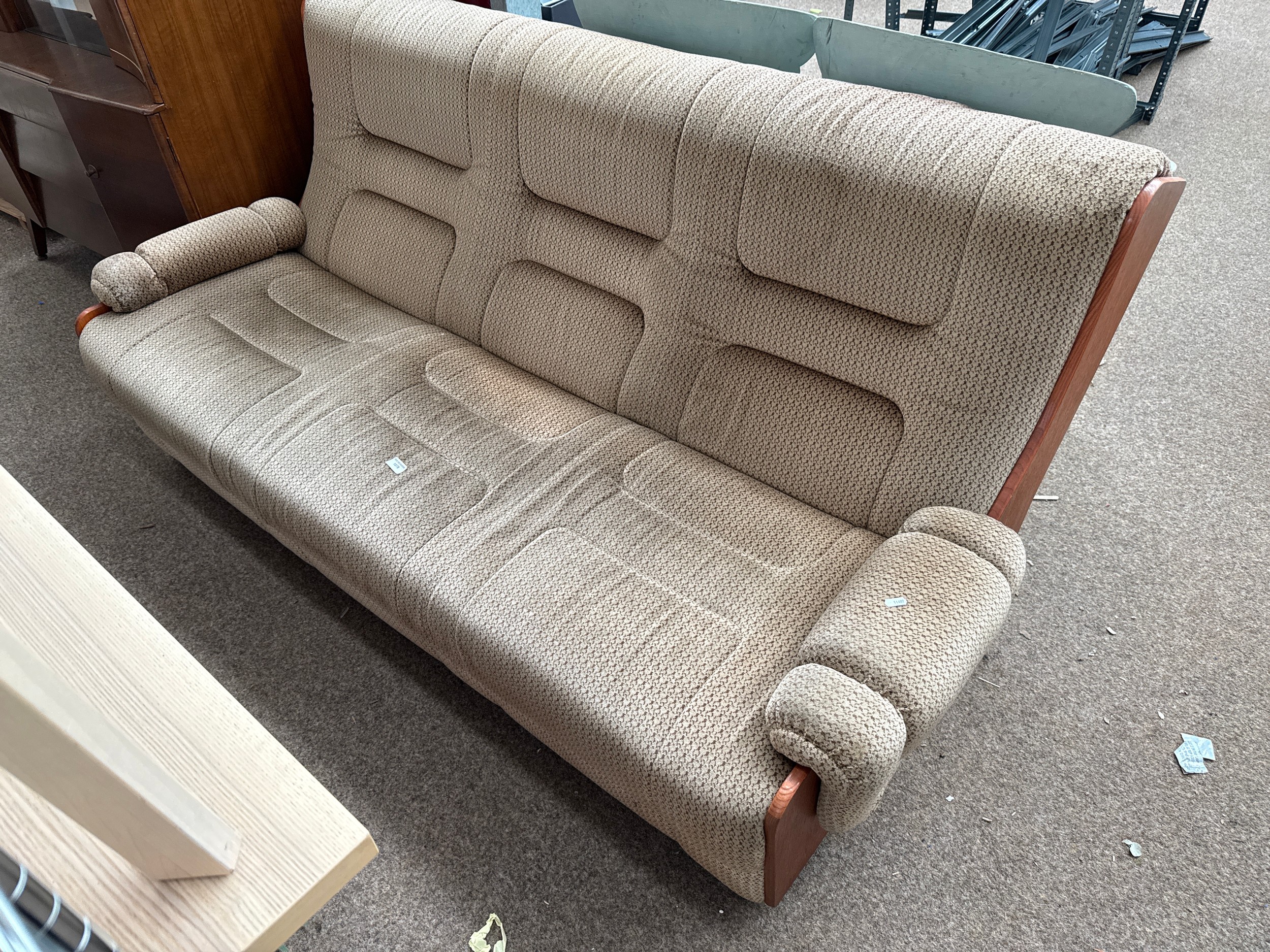 A vintage wood framed upholstered settee