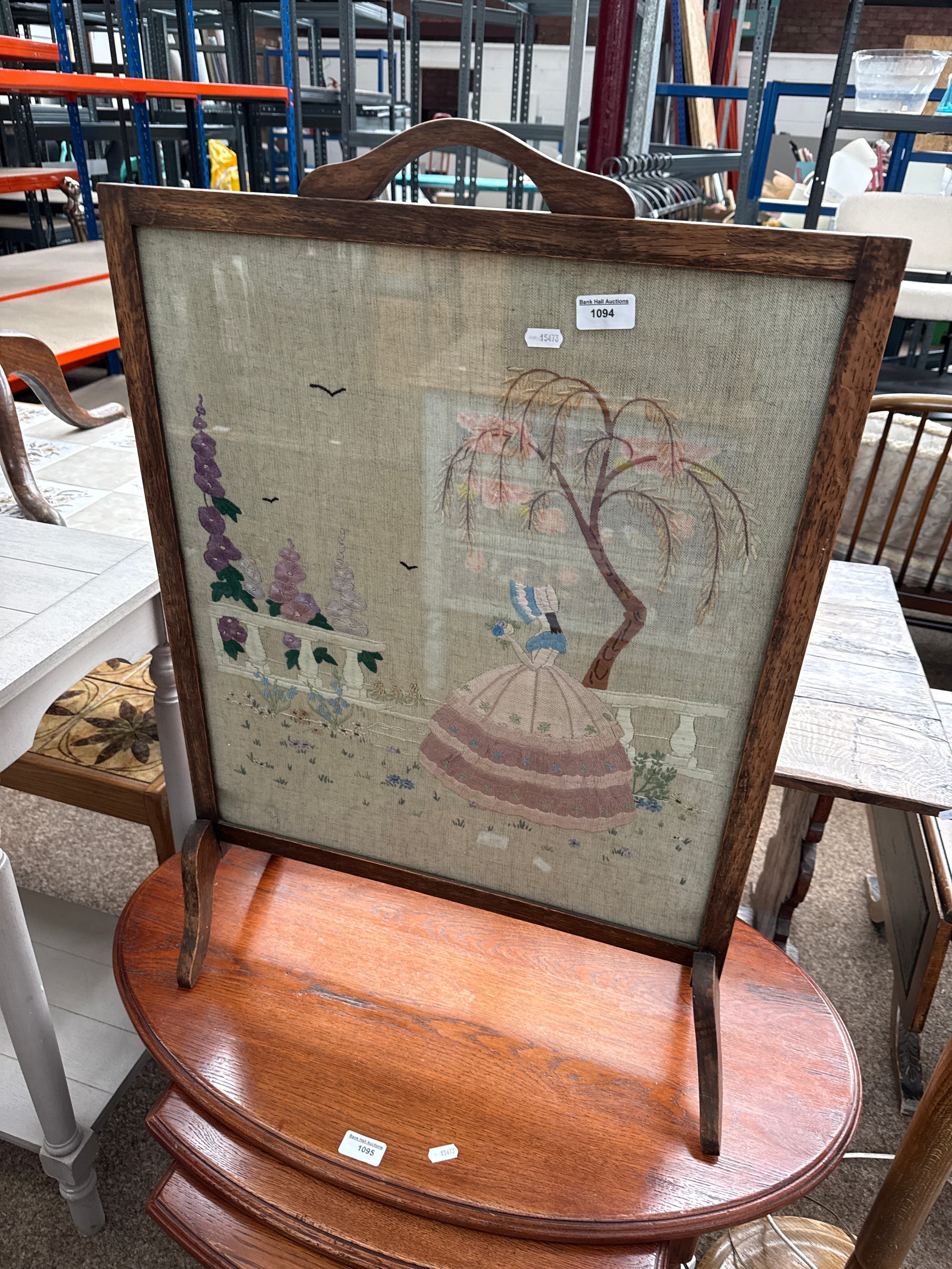 A vintage glazed fire screen with embroidered panel - a/f leg