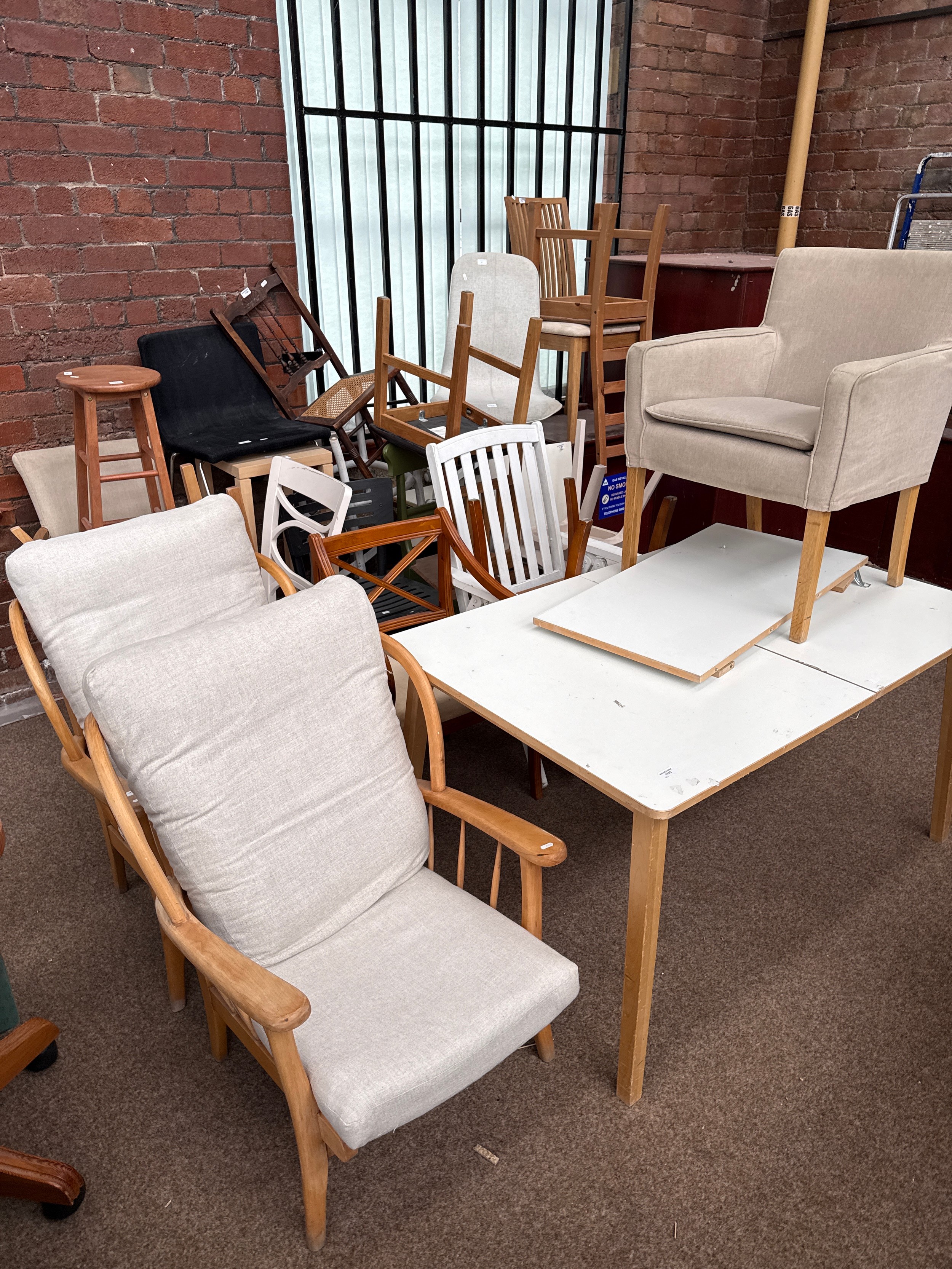 A quantity of assorted chairs and a large extending table - as found