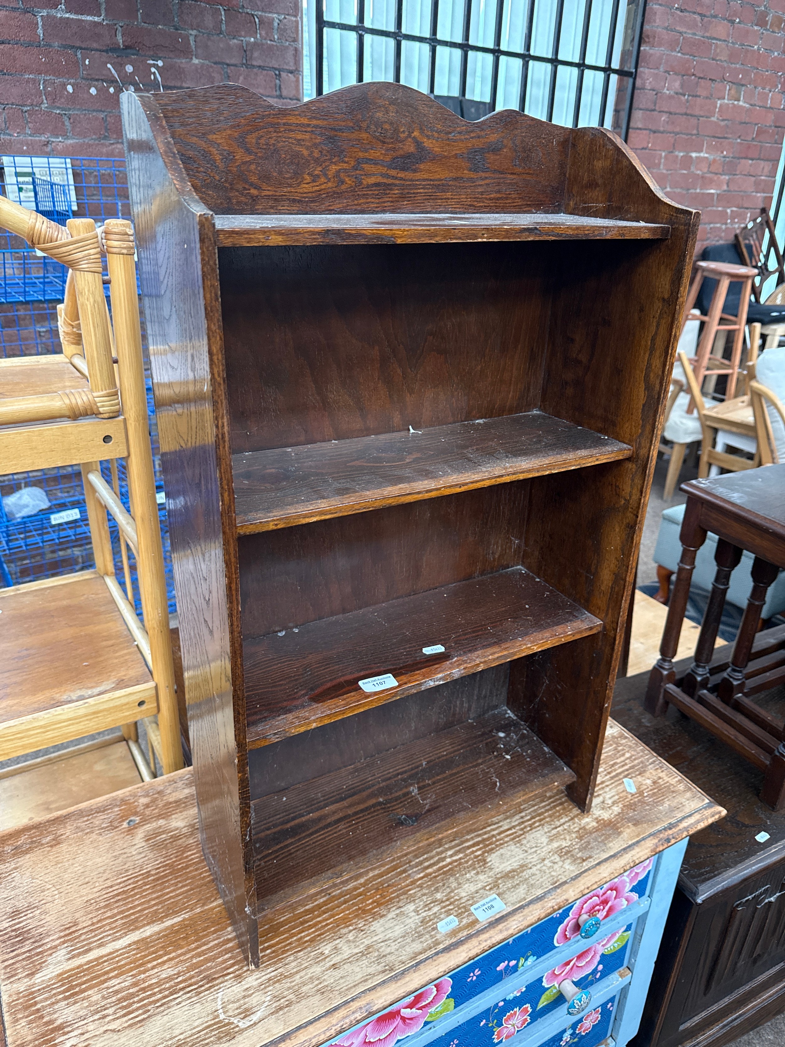 A small vintage oak open bookcase