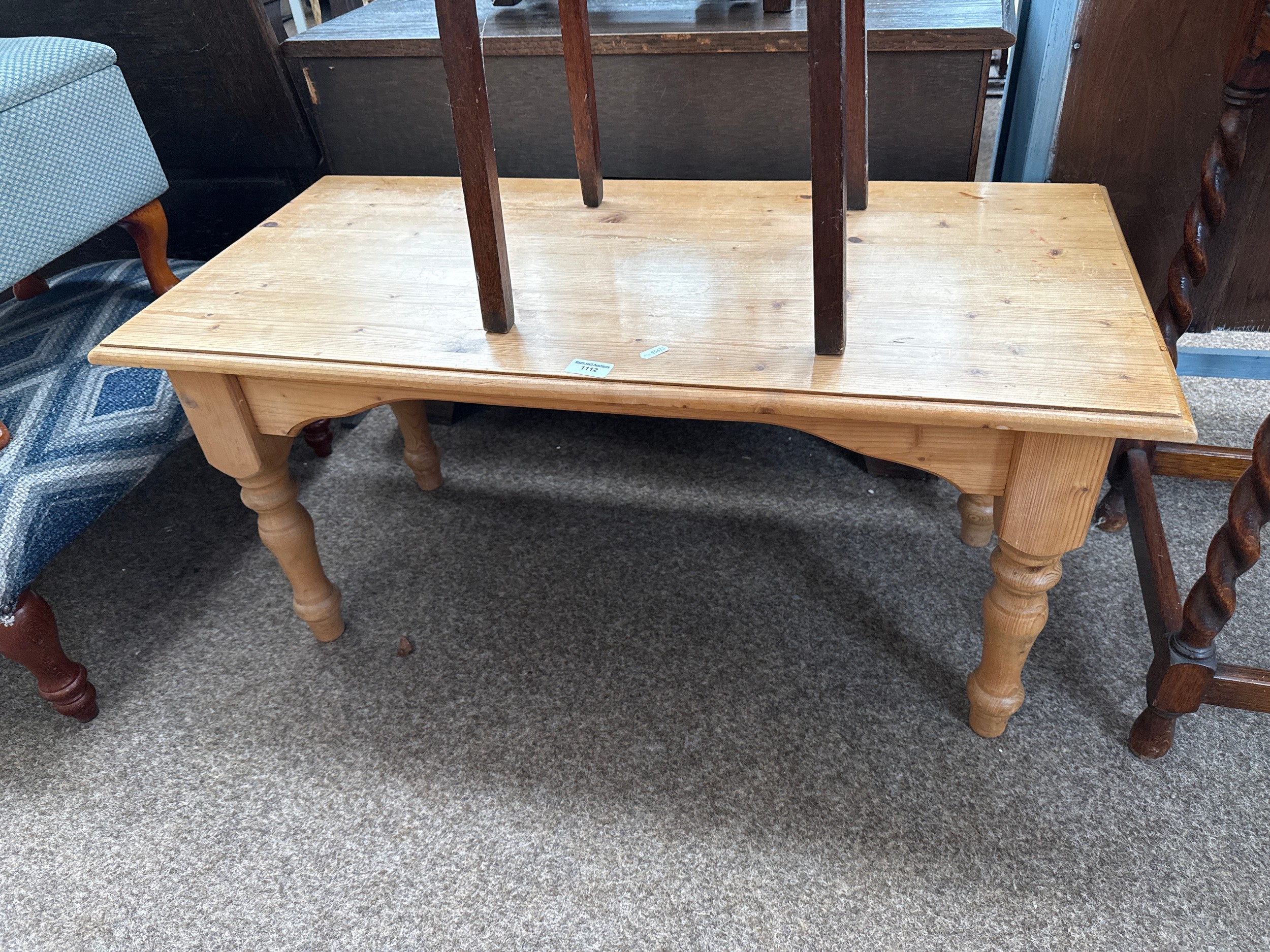 A small vintage knotty pine coffee table