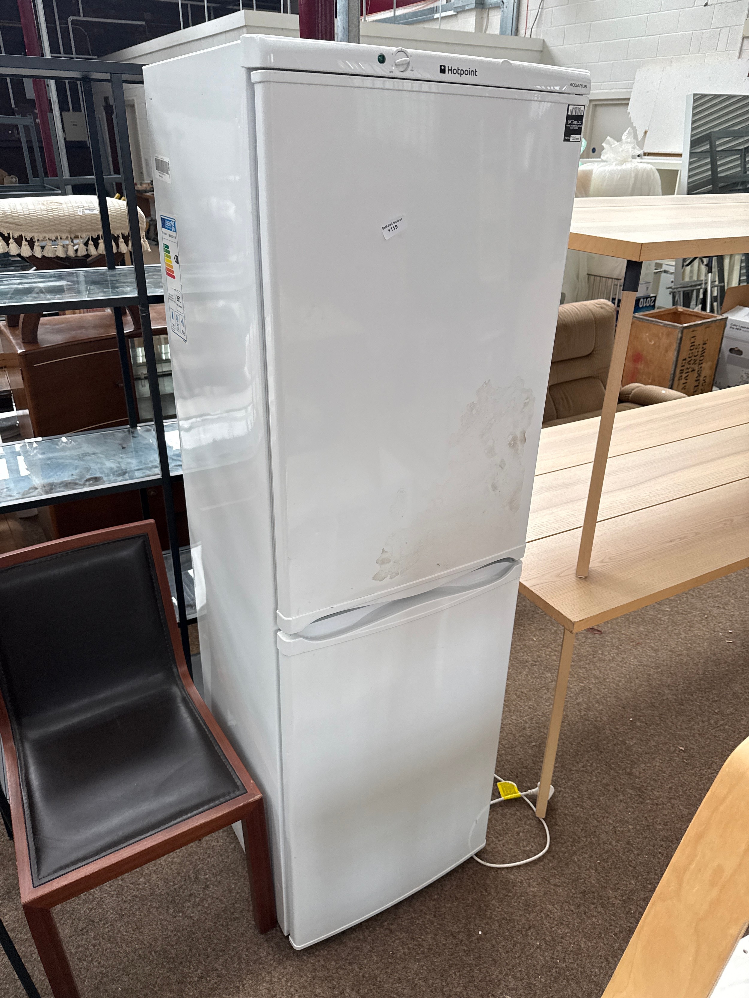 A large HOTPOINT Aquarius fridge freezer cabinet
