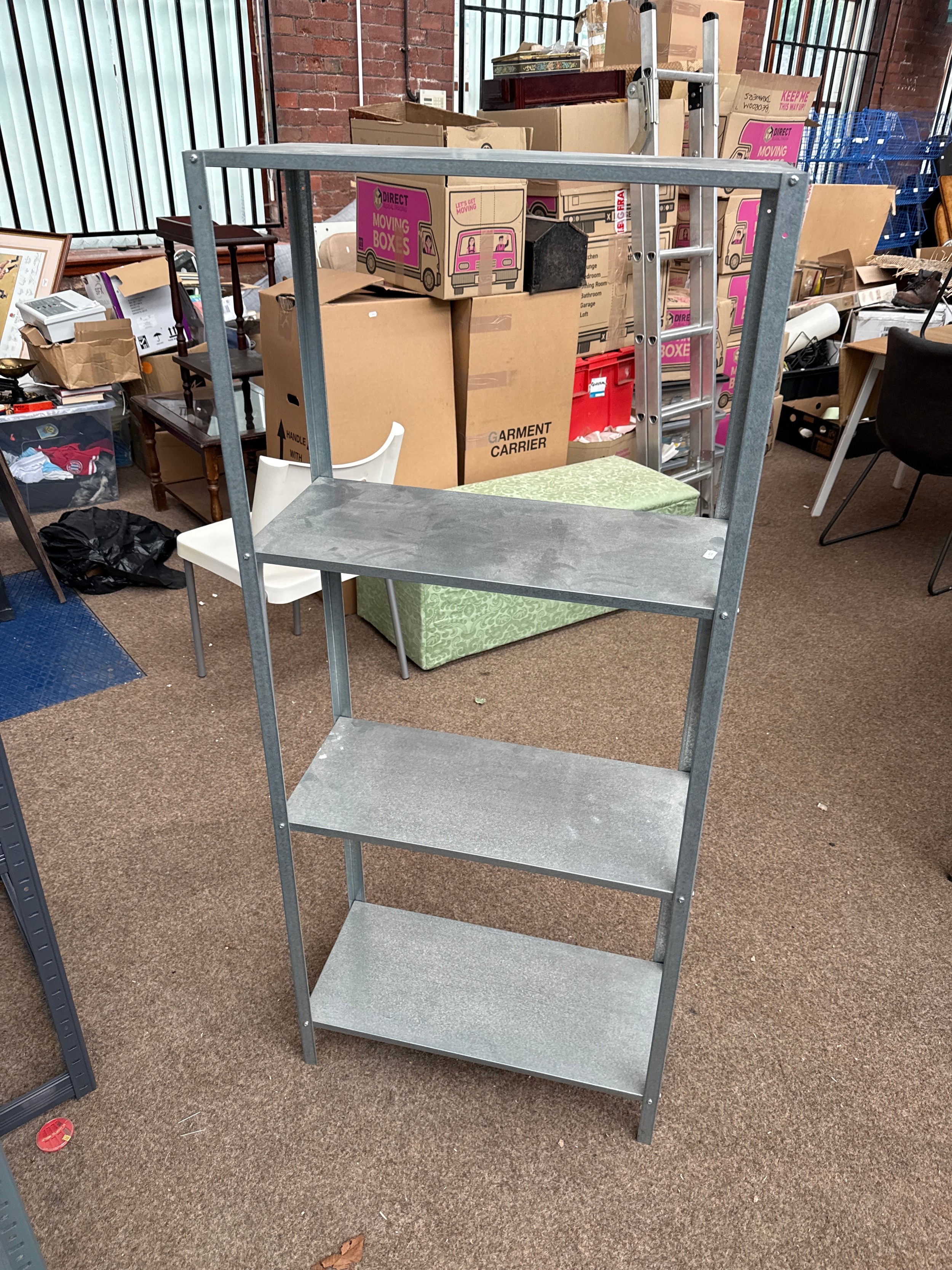 A small galvanised metal 4 tier shelf stand