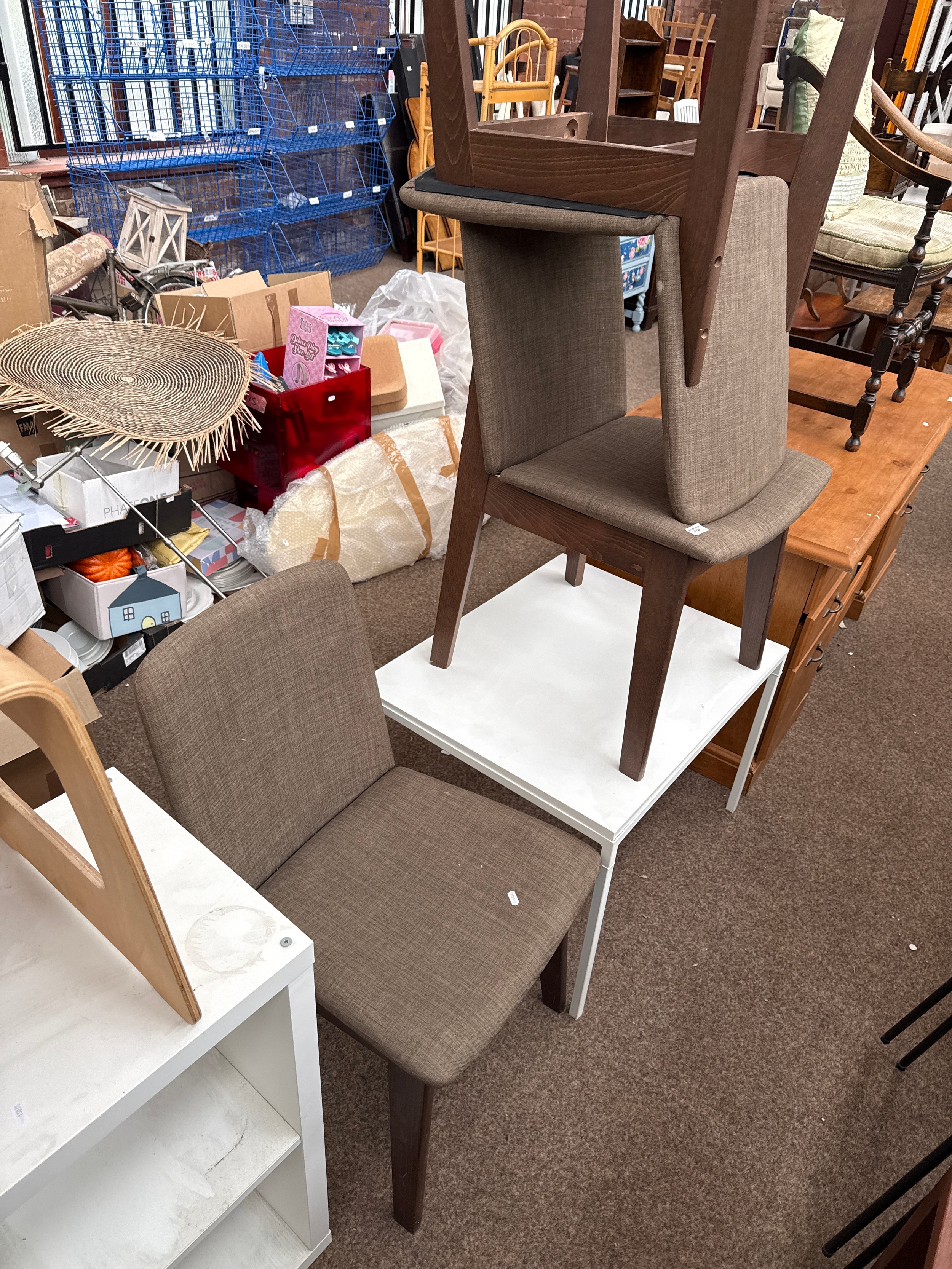 A square white side table and 3 x Julian Bowen chairs with upholstered seats