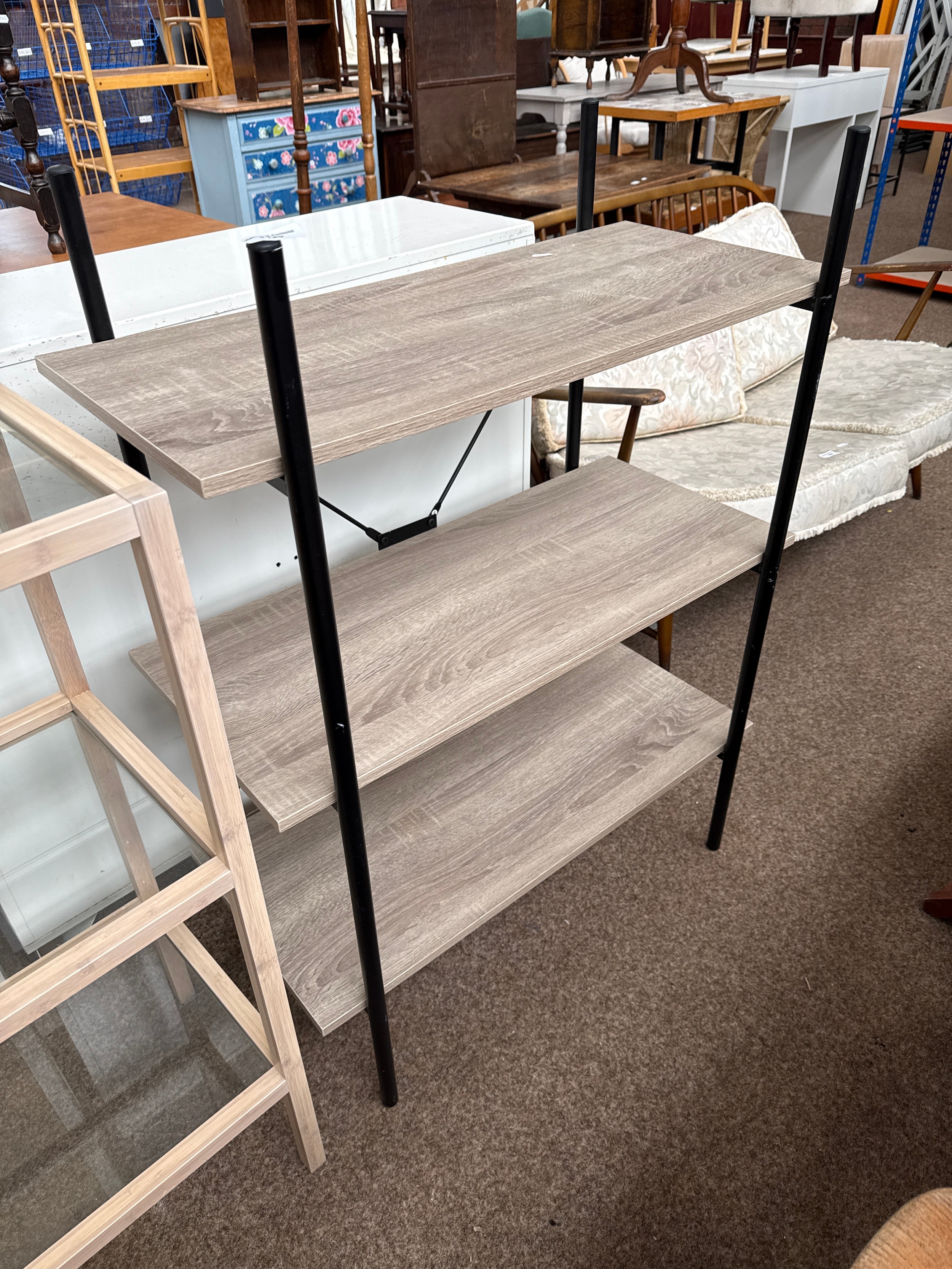 A modern metal framed 3 tier shelf stand