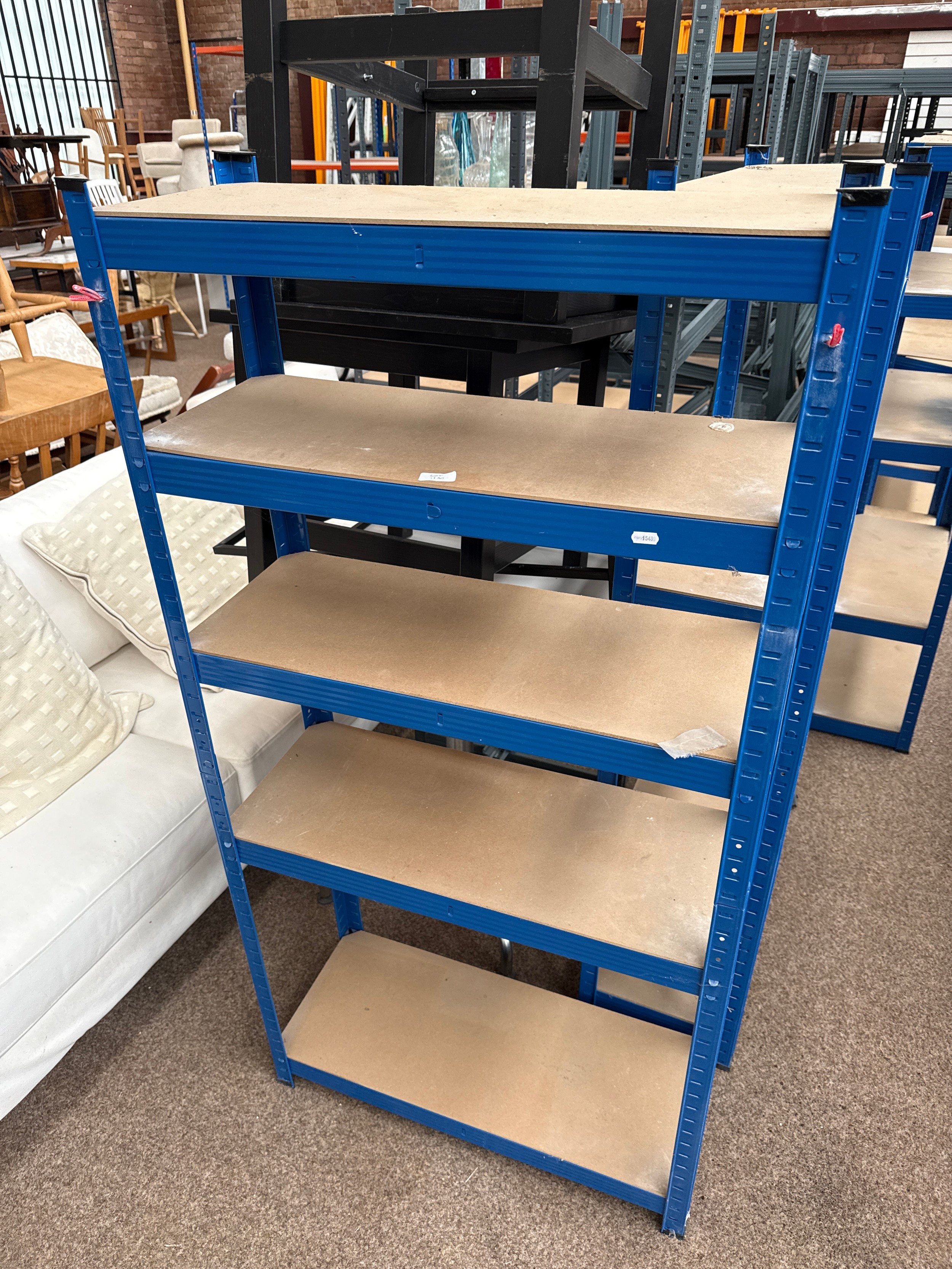 A small adjustable metal framed shelf stand