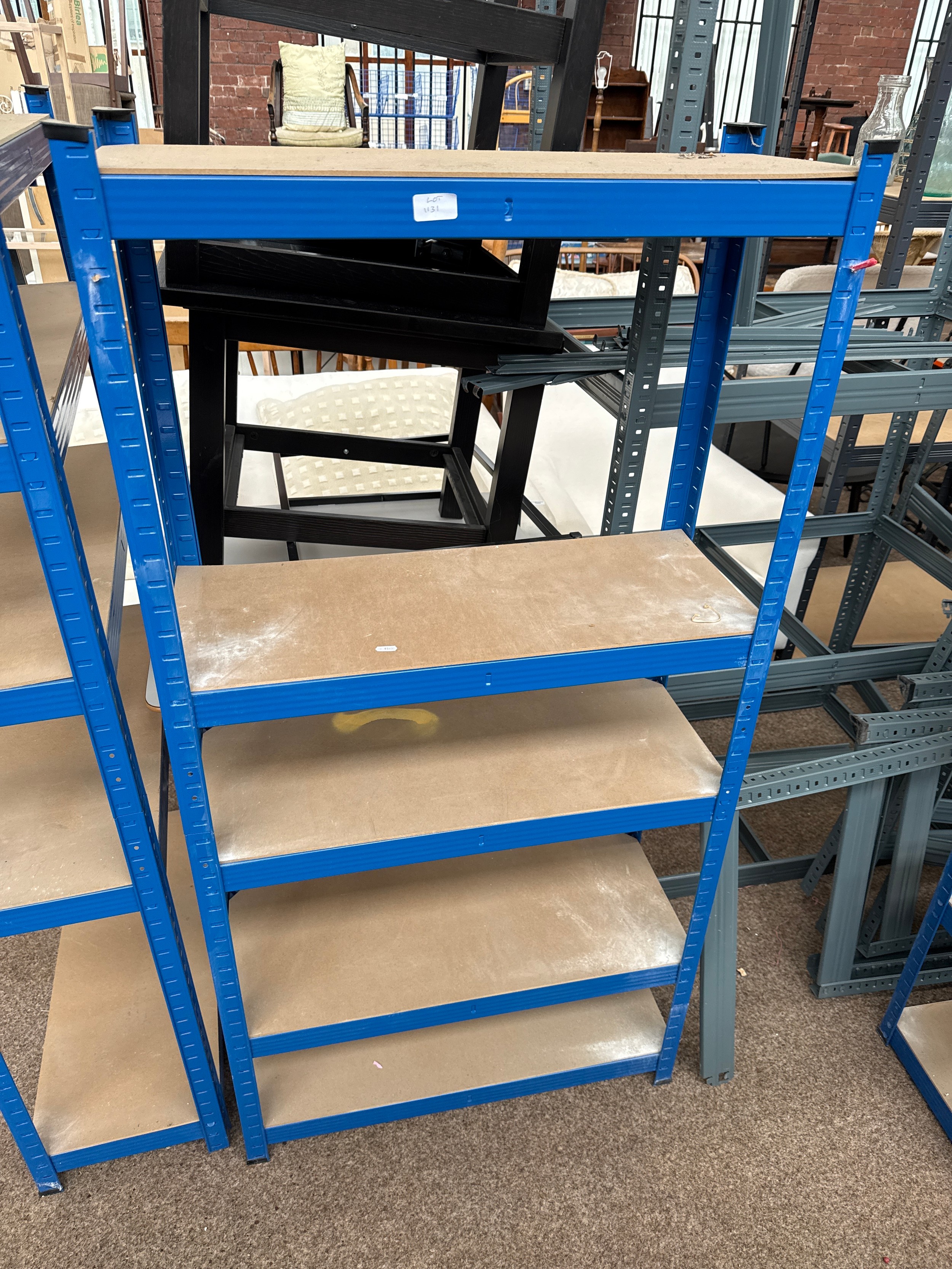 A small adjustable metal framed shelf stand