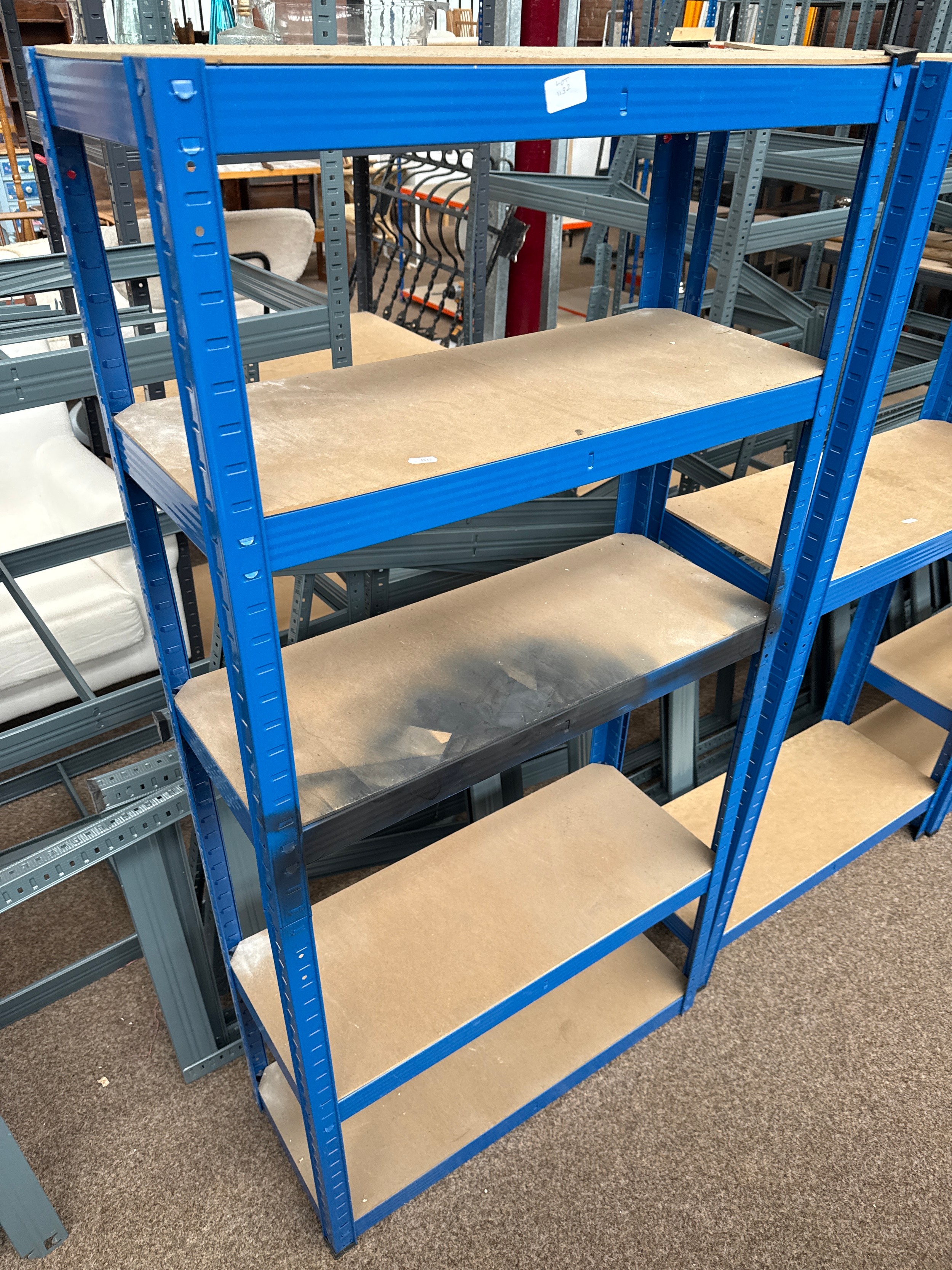 A small adjustable metal framed shelf stand