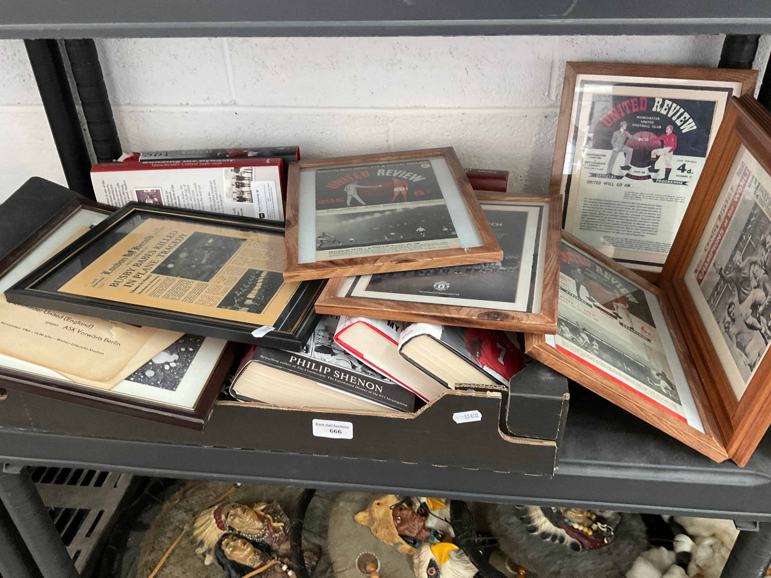 Collection of framed Manchester united programmes and Manchester united books