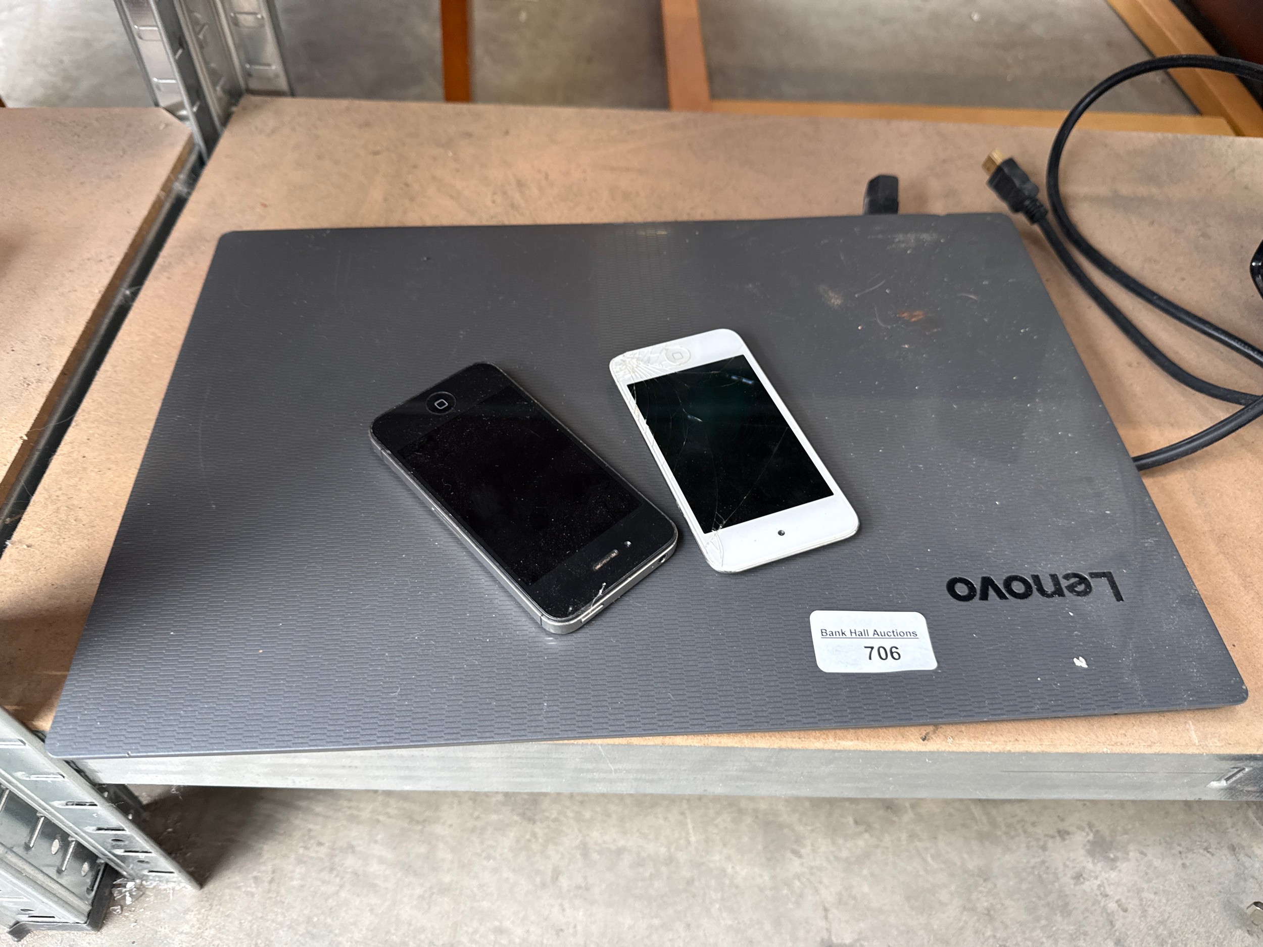 Lenovo laptop and two phones
