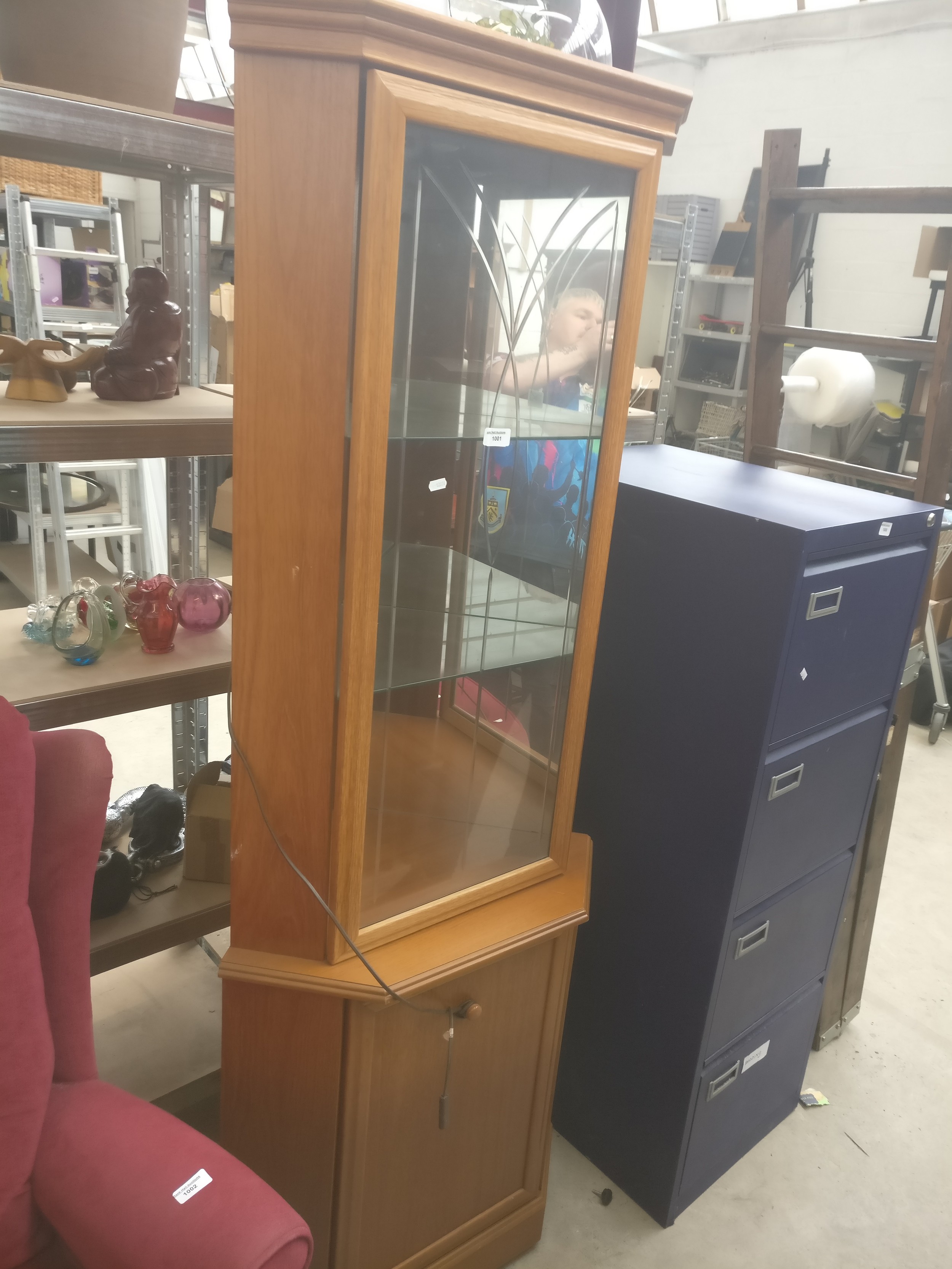 A vintage glazed corner cabinet